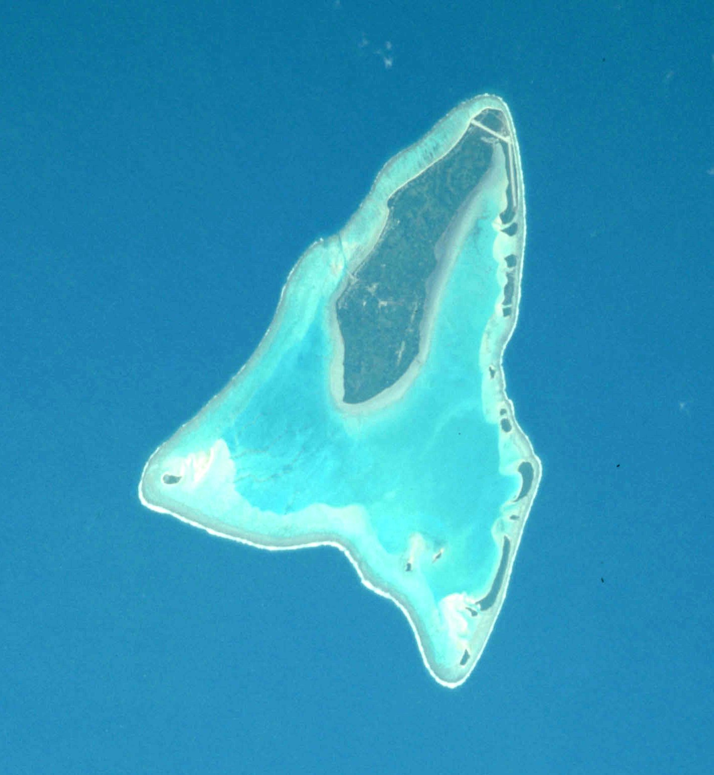 Copped from Apollo-Soyuz Test Project photo AST-01-039 to show Aituctaki Atoll in the Cook Islands.  North is up and slightly to the right.