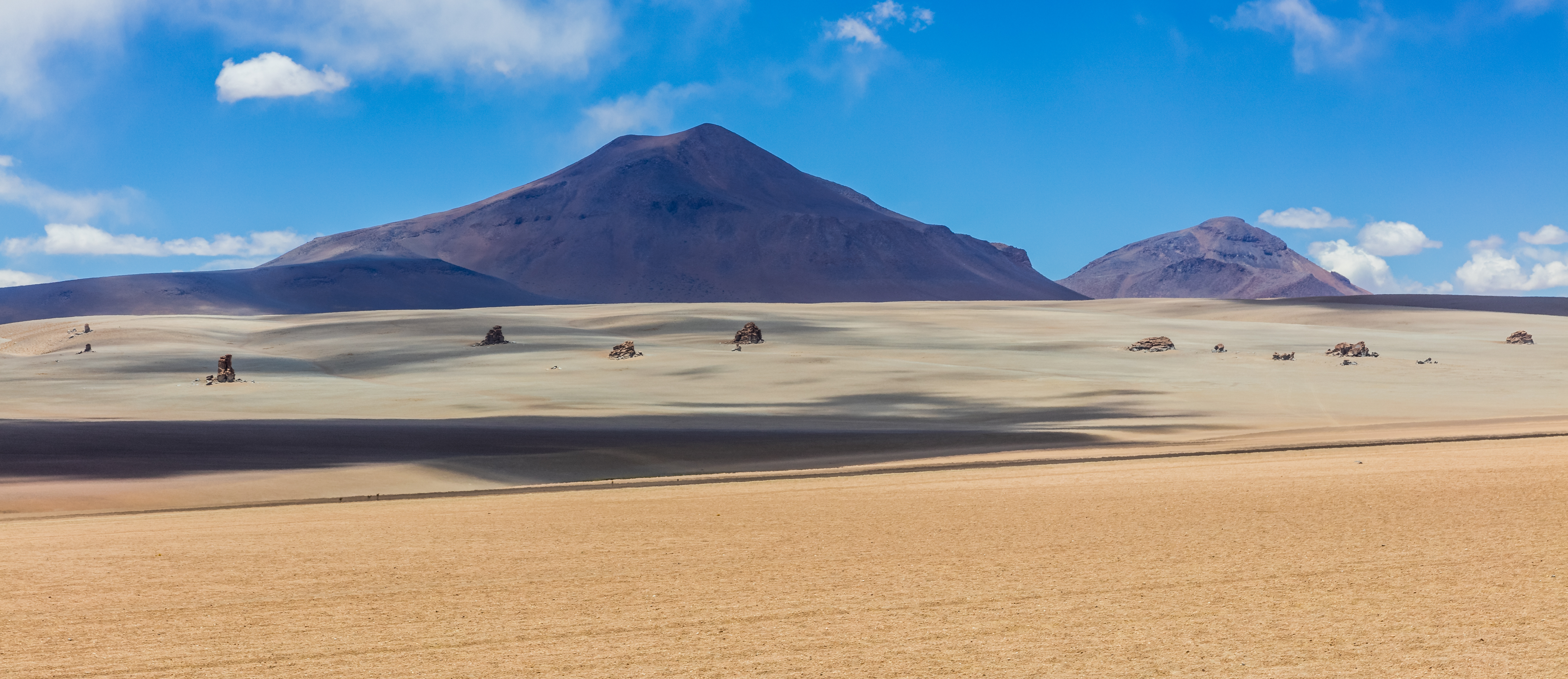 The Salvador Dalí Desert is located in the Eduardo Avaroa Andean Fauna National Reserve, Potosí Department, southwestern Bolivia. The place is called like this because similar landscapes have been painted by Salvador Dalí, although he was never there or knew about it.