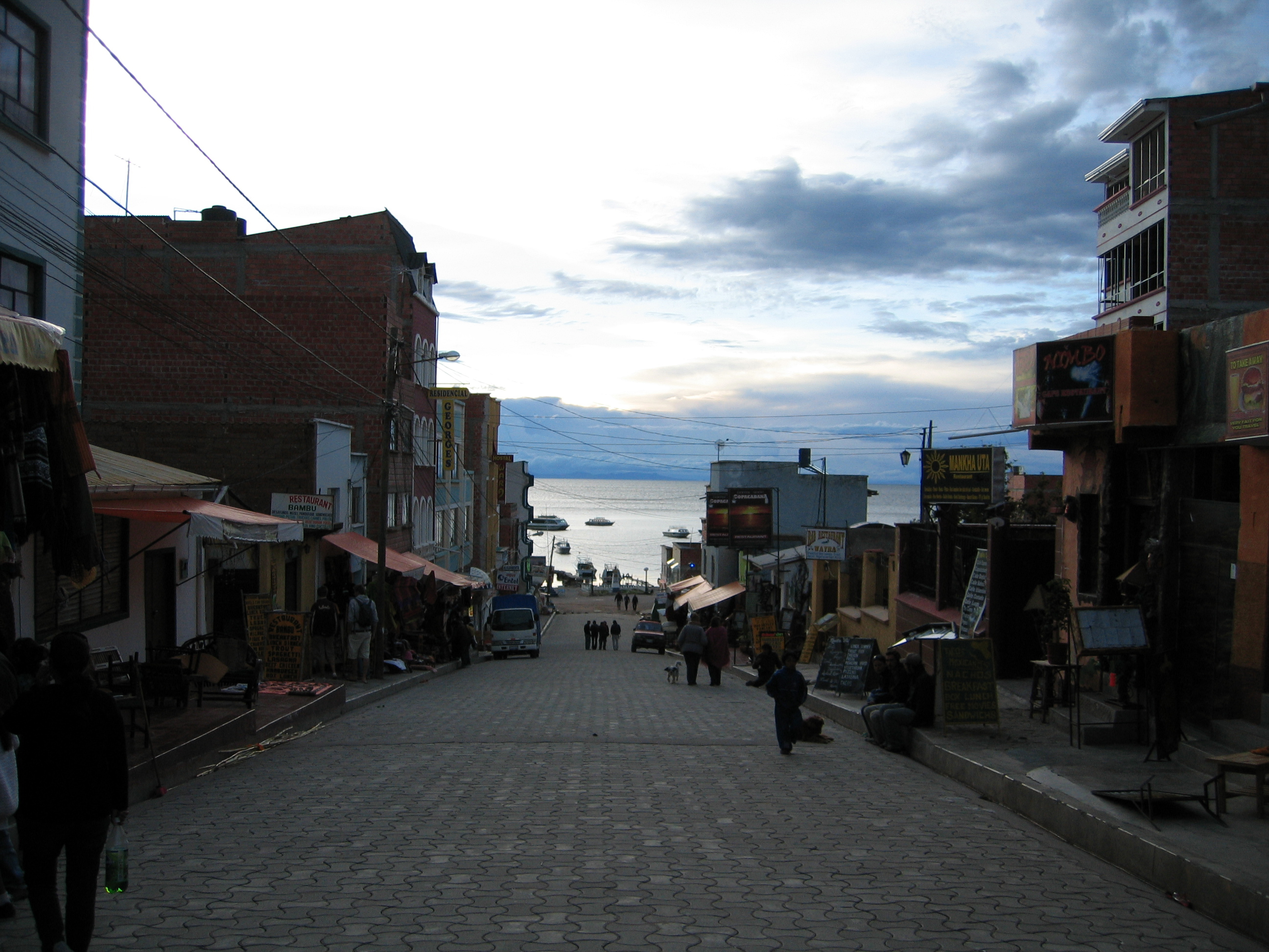 Shopping street in Copacabana with lake Titicaca in the background.