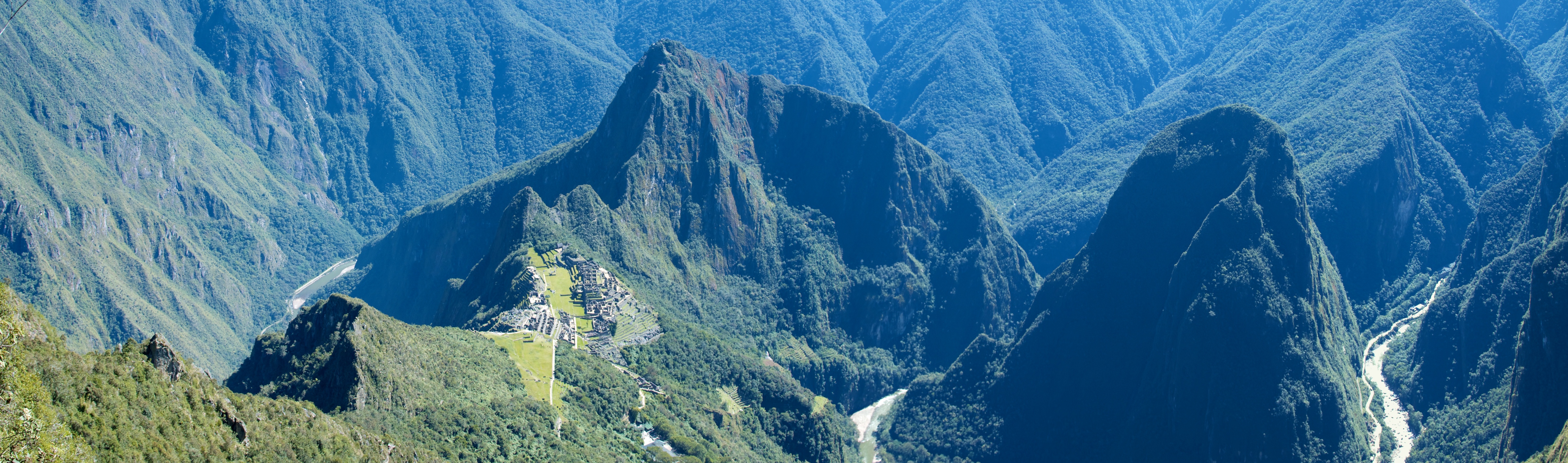 The peeks and valleys surrounding Machu Picchu like a wreath are almost more beautiful and awing than the site itself. It is lush and rugged terrain with the Urubamba River weaving drunkenly through.
From Machu Picchu Mountain you can really get a sense of the high protected plateau Machu Picchu was built on and how remote and inaccessible the site is. It is simply gorgeous country.