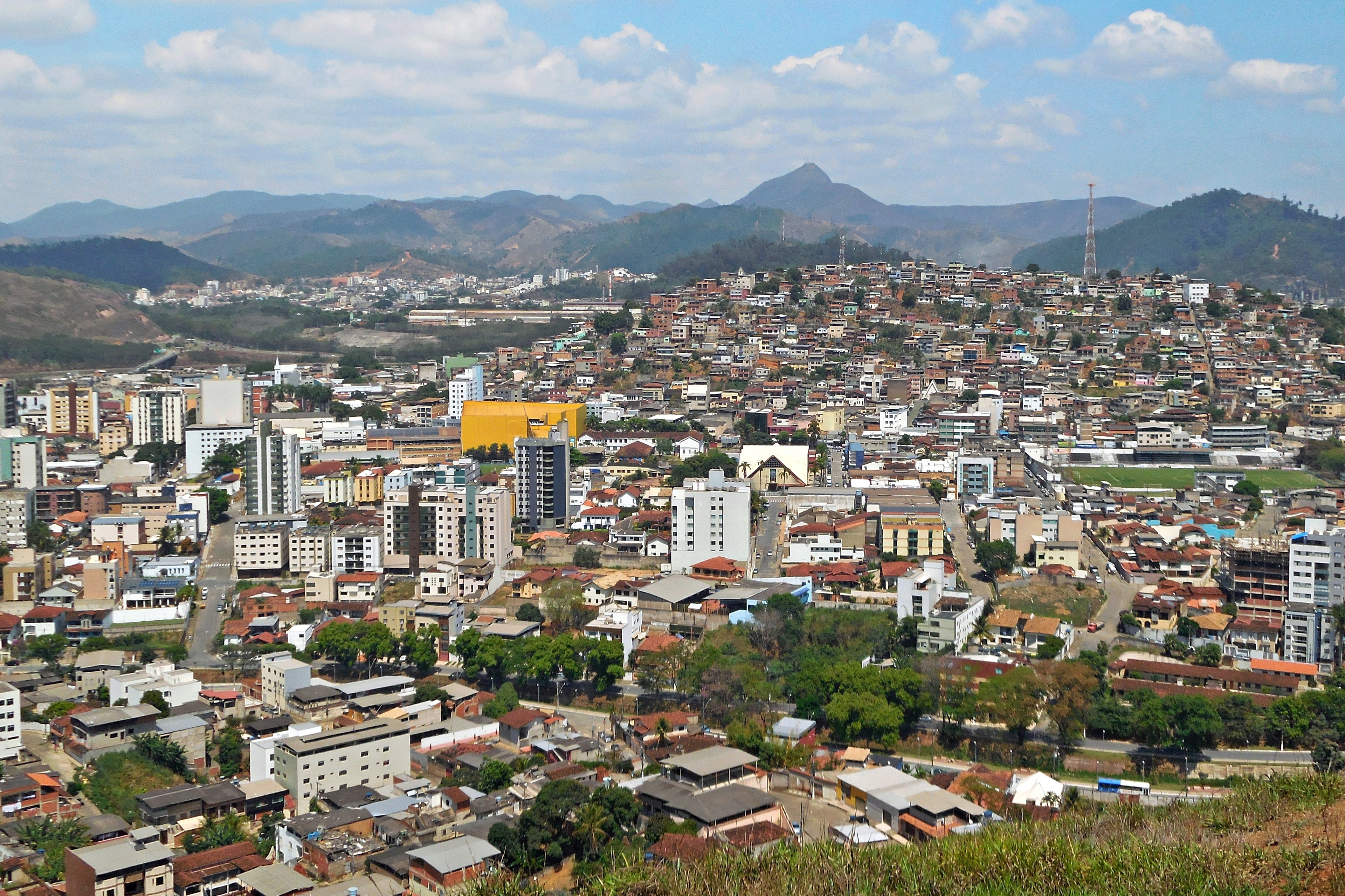 View of the downtown seen from of the high on the Santa Terezinha neighborhood, in Coronel Fabriciano, Minas Gerais, Brazil. Ana Moura peak in background.