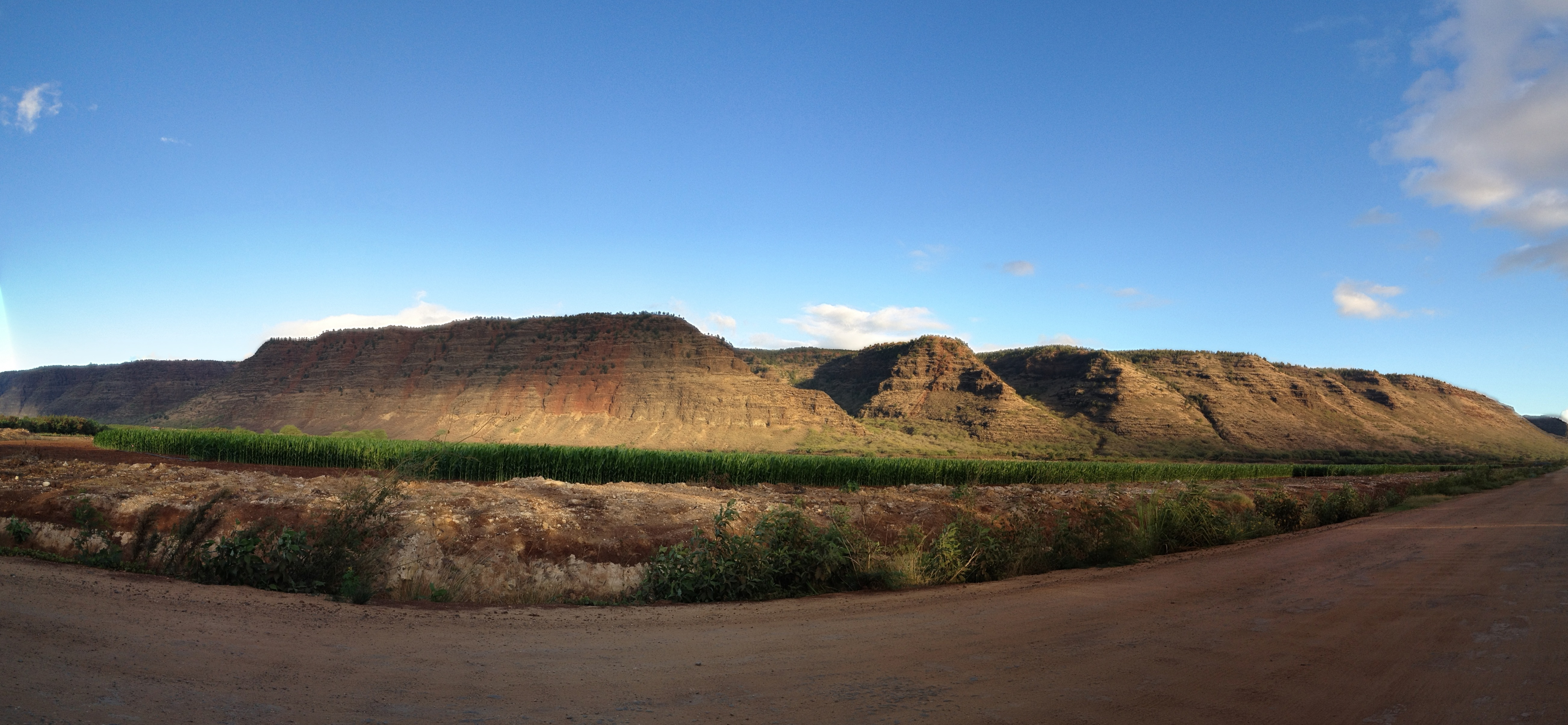 A panoramic view of the ridge enclosing ‘Ohai‘ula Valley, at the western end of the island of Kauai, Hawaii, as seen from the road to Polihale State Park.