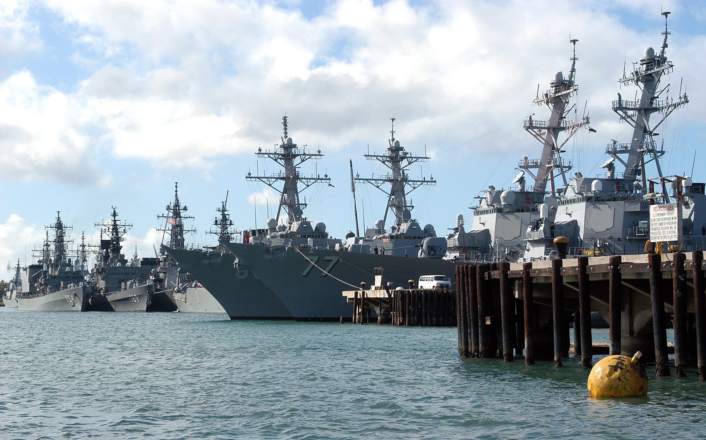 Pearl Harbor, Hawaii (July 2, 2004) - Warships from several nations sit pierside at Naval Station Pearl Harbor, Hawaii. The ships are participating in this year's Rim of the Pacific (RIMPAC) exercise. RIMPAC is the largest international maritime exercise in the waters around the Hawaiian Islands. This year’s exercise includes seven participating nations; Australia, Canada, Chile, Japan, South Korea, United Kingdom and United States. RIMPAC is intended to enhance the tactical proficiency of participating units in a wide array of combined operations at sea, while enhancing stability in the Pacific Rim region. U.S. Navy photo by Photographer's Mate 2nd Class Bradley J. Sapp (RELEASED) For more information go to: <a href="http://www.cpf.navy.mil/RIMPAC2004" Target="_BLANK">http://www.cpf.navy.mil/RIMPAC2004</a>/