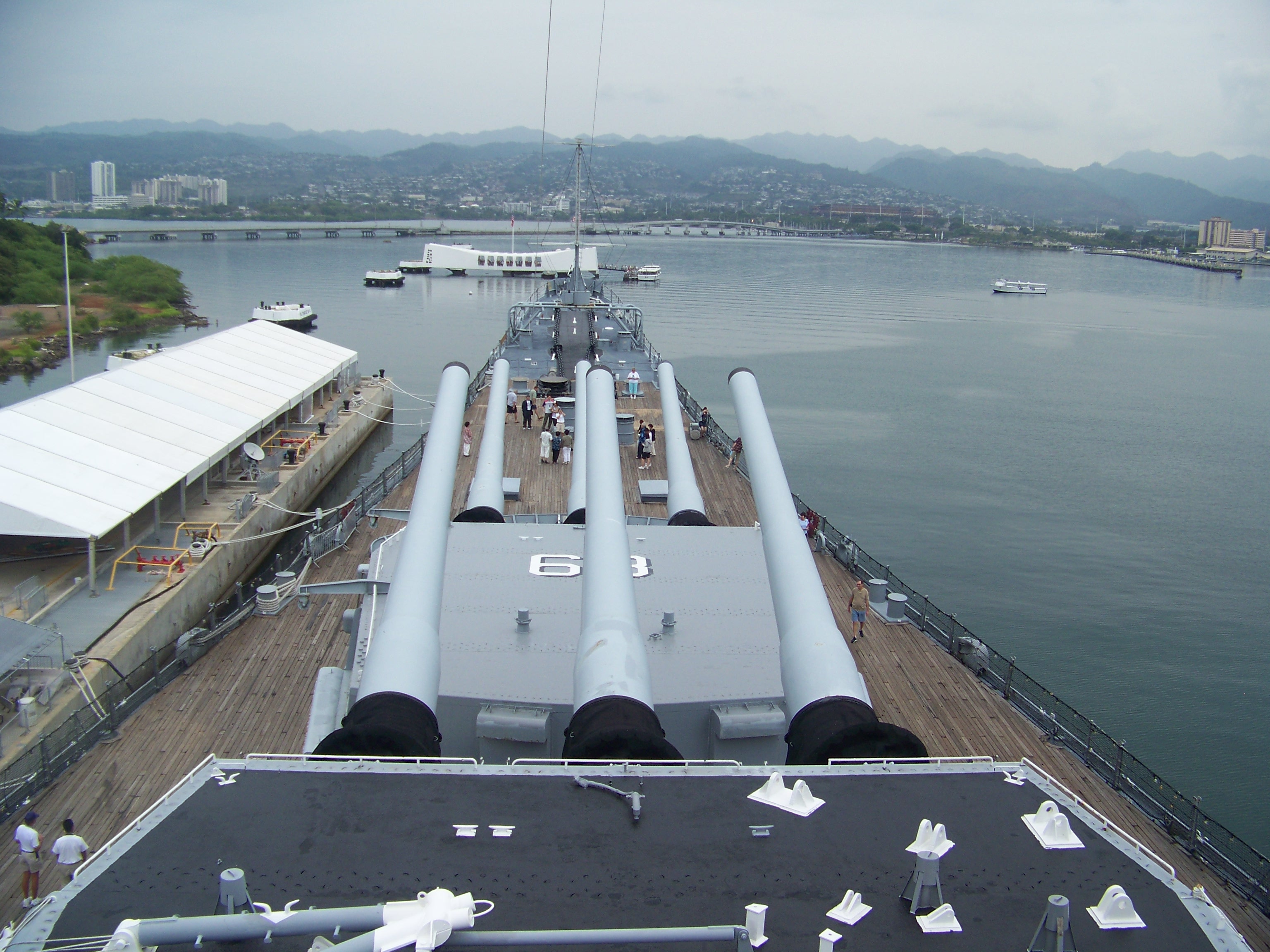 The USS Missouri (BB-63) watching over the sunken USS Arizona (BB-39) in Pearl Harbor, symbols of the beginning and the end of WWII for the USA.