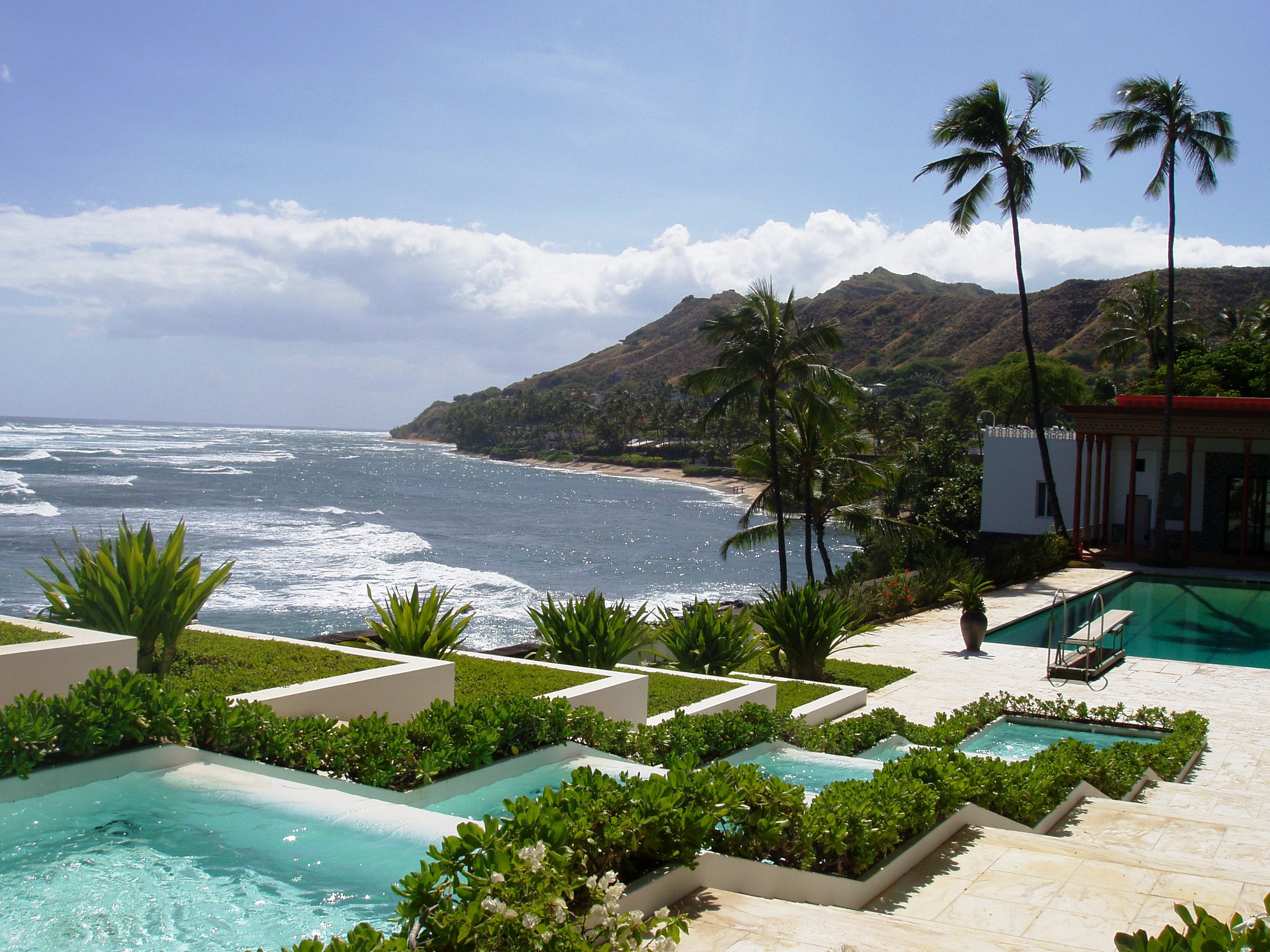 Shangri La gardens with swimming pool and fountain, and view of coast to Diamond Head.
Near Honolulu, Hawaii.