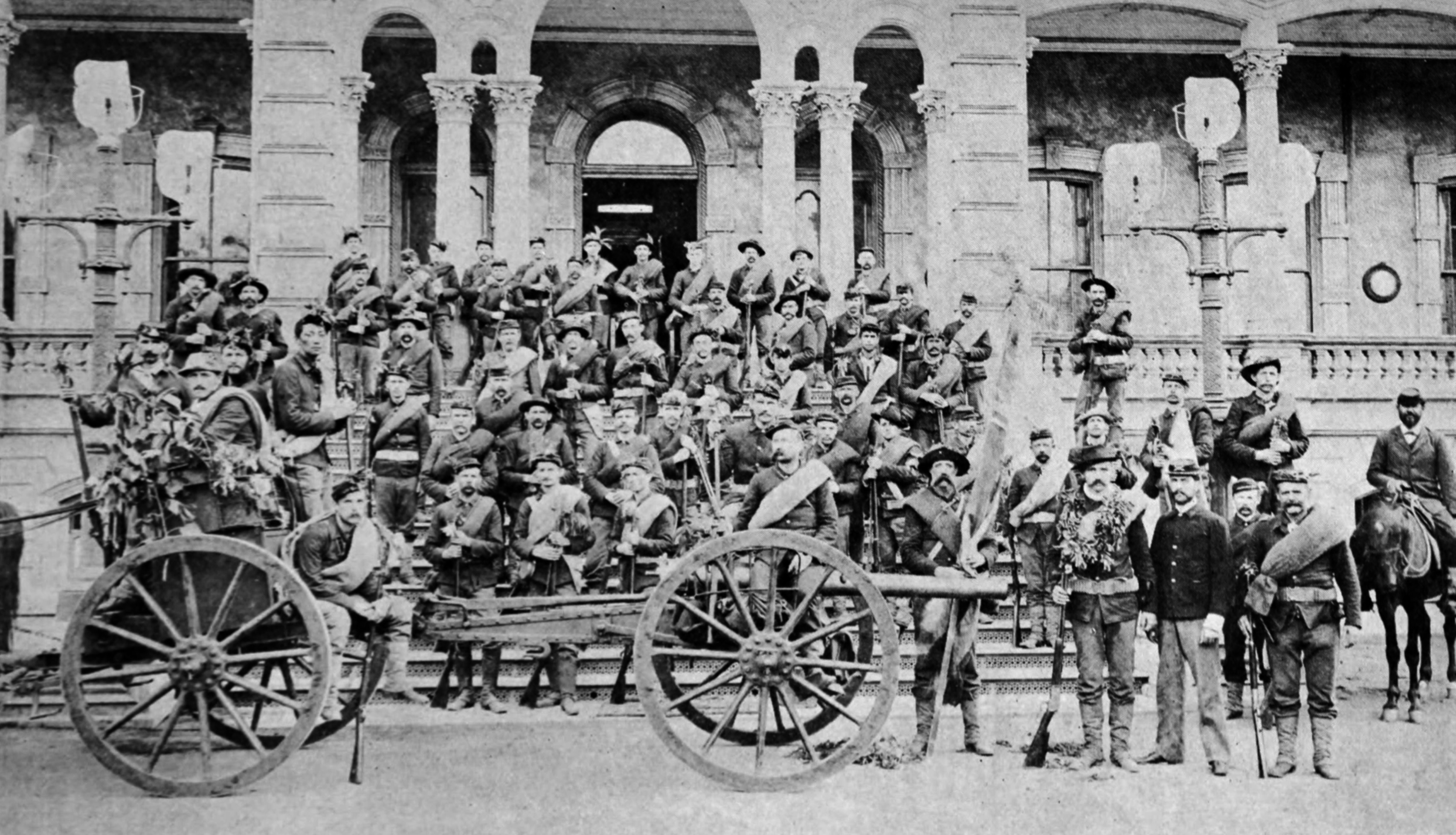 Troops of the Republic of Hawaii, photographed on the front step of the Iolani Palace on their return from service against Hawaiian revolutionist in the uprising of 1895.