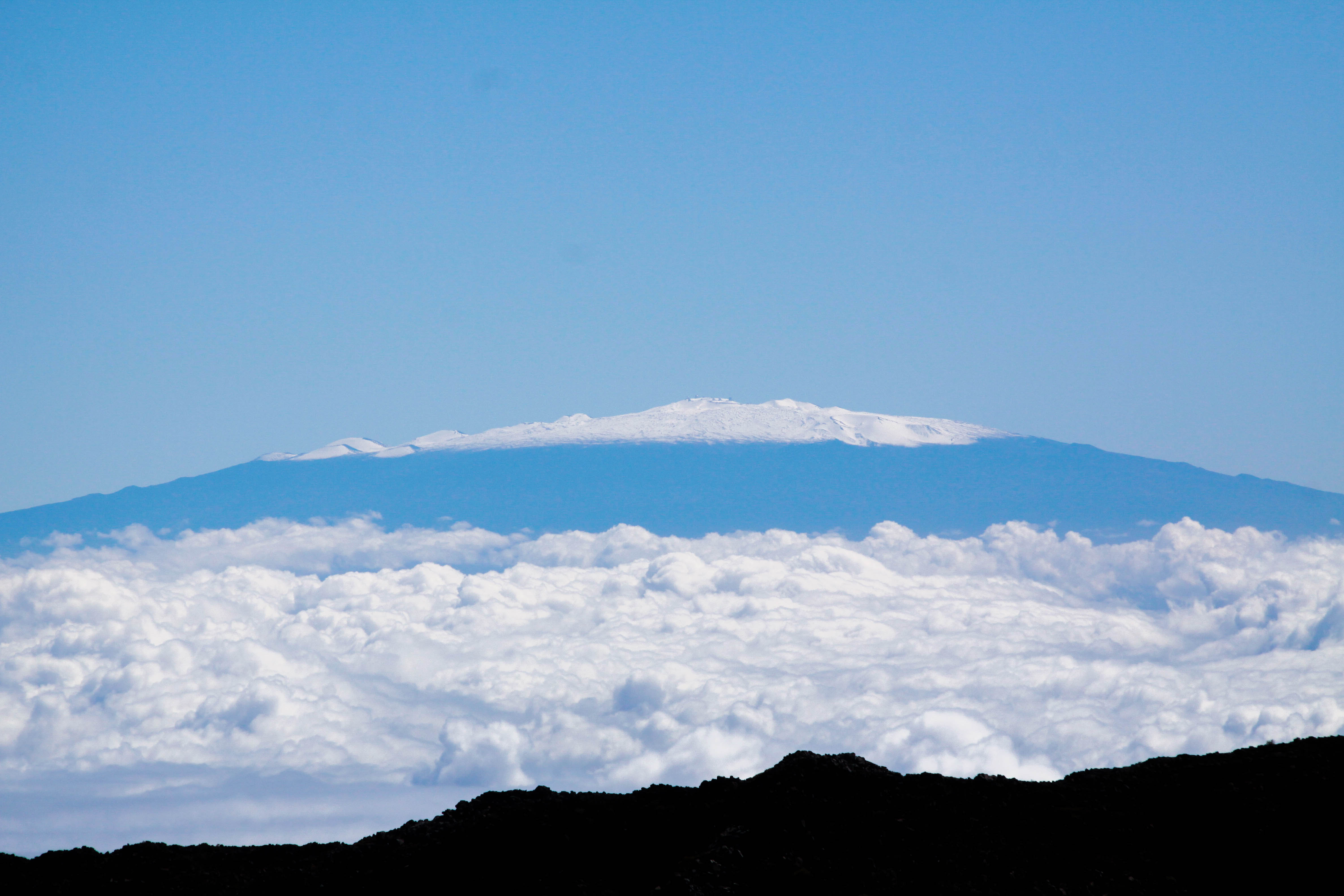 The view of Mauna Kea from the summit of the Haleakala Volcano on the island of Maui