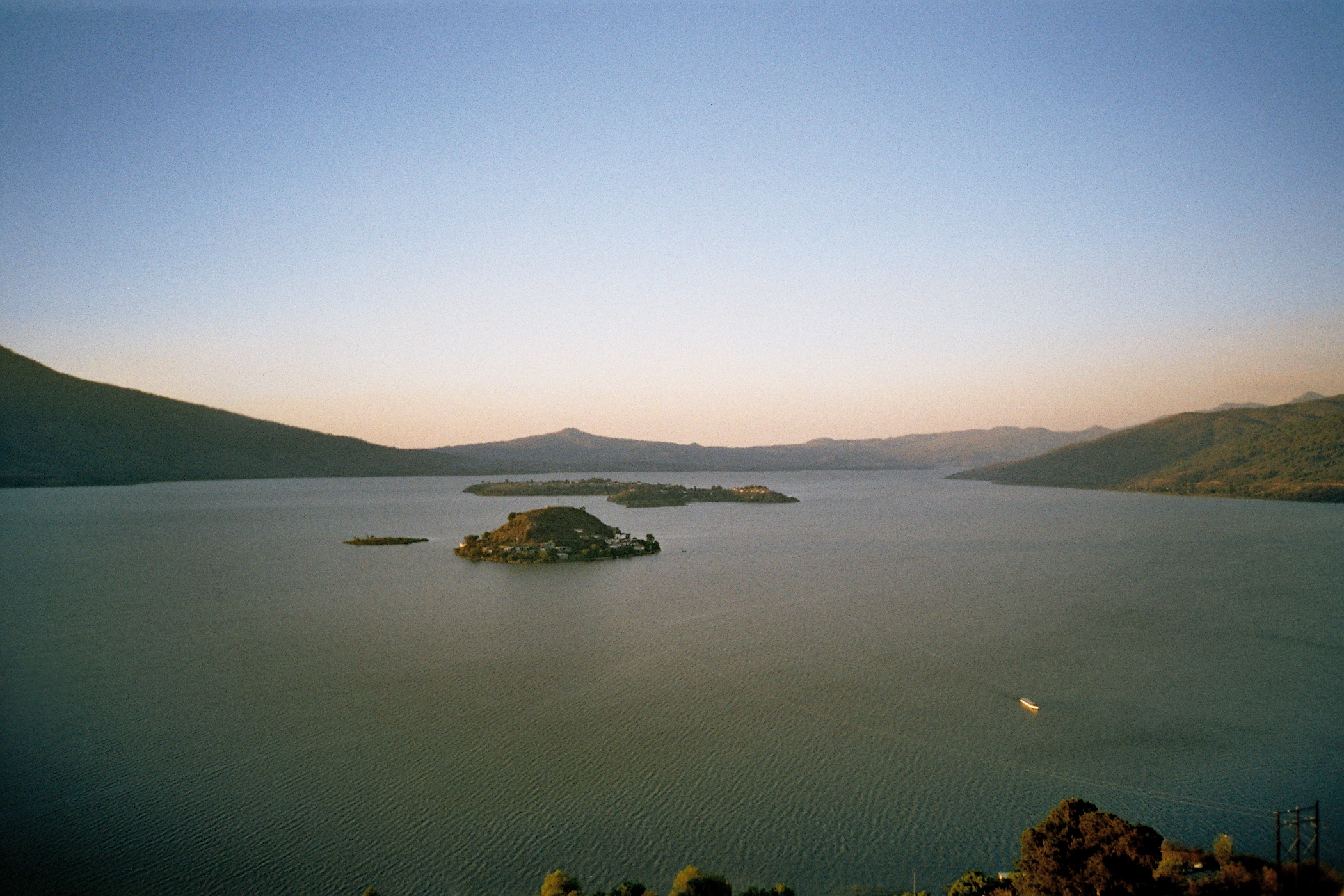 Some islands in Lake Pátzcuaro, photographed from the top of the Janitzio island in Michoacan, Mexico.
Picture taken in the spring of 2005 by me.

Note: I do not know the names of the islands in the photograph, some one who know them should edit this summary.
