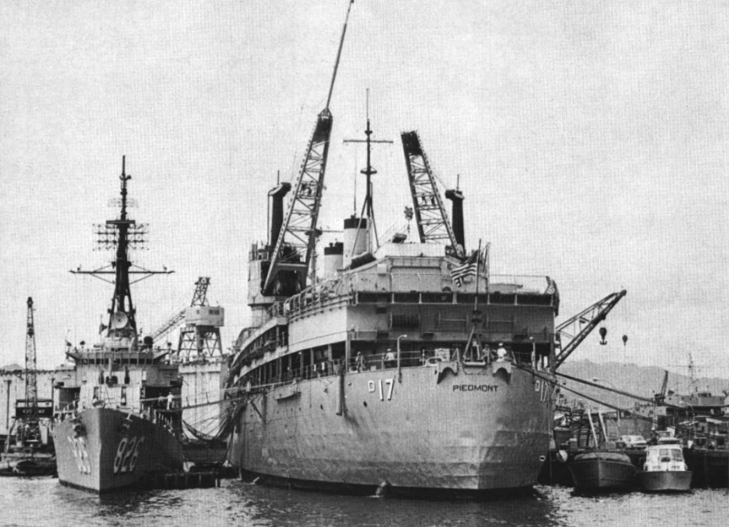 Aft view of the U.S. Navy submarine tender USS Piedmont (AD-17), probably at Subic Bay, Philippines. Alongiside is the destroyer USS Agerholm (DD-826).