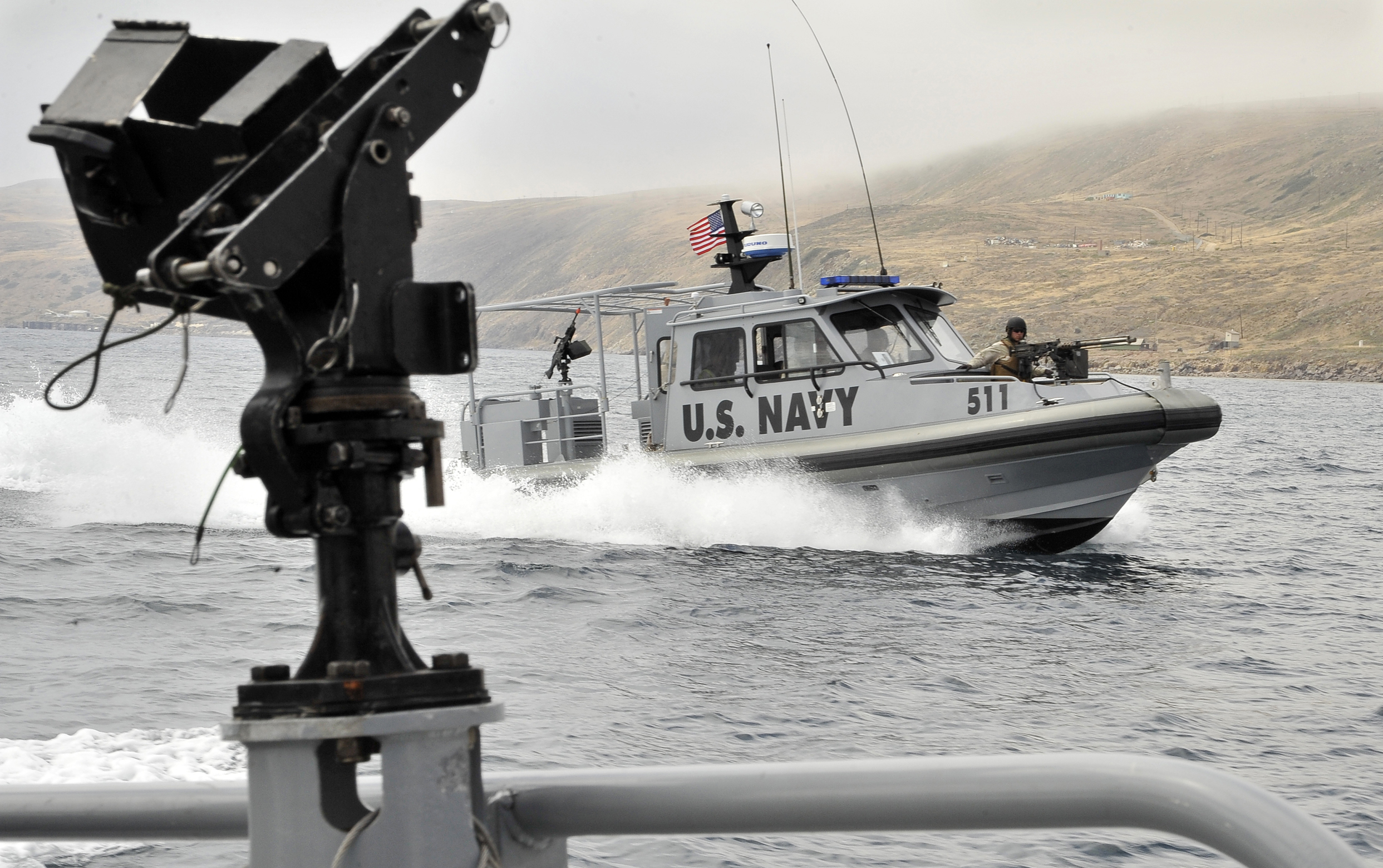 SAN CLEMENTE ISLAND, Calif. (July 19, 2011) Sailors assigned to Maritime Expeditionary Security Squadron (MSRON) 11 conduct patrol boat maneuvers on a 34-foot Sea Ark Dauntless tactical craft off San Clemente Island during ULTRA 2011.  ULTRA is a two-week exercise focusing on expeditionary warfare skill qualifications and battle readiness to prepare for deployments. (U.S. Navy photo by Mass Communication Specialist 2nd Class Noel L. Danseco/Released)