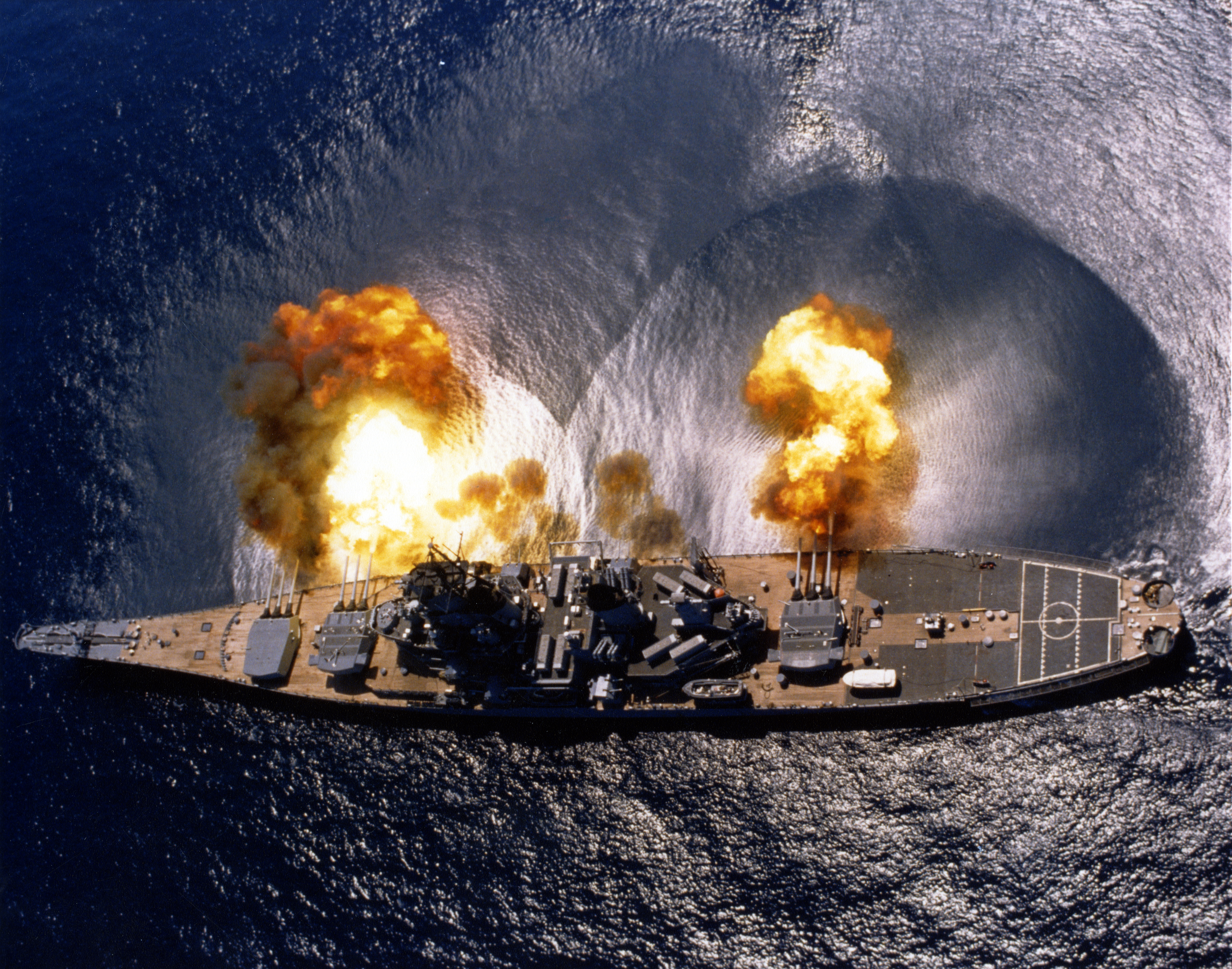 USS Iowa (BB-61) fires a full broadside of her nine 16″/50 and six 5″/38 guns during a target exercise near Vieques Island, Puerto Rico (21°N 65°W﻿ / ﻿21°N 65°W﻿ / 21; -65). Note concussion effects on the water surface, and 16-inch gun barrels in varying degrees of recoil.