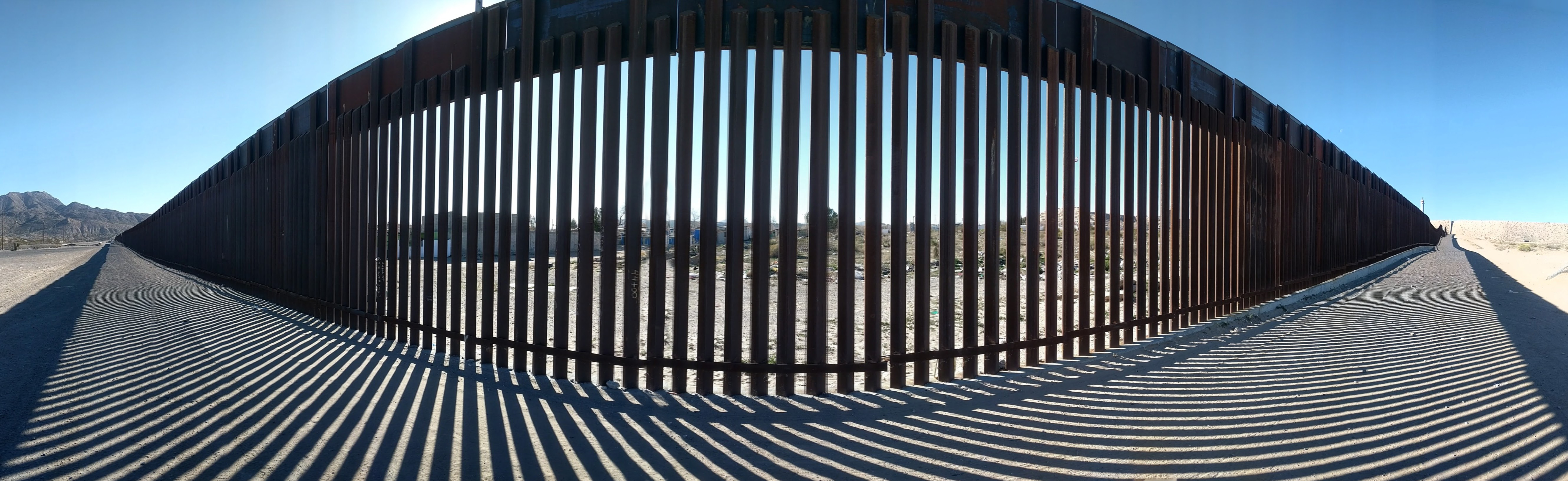Panoramic view from the US side of the new (2017) border wall between Sunland Park, New Mexico, United States, and Anapra, Chihuahua, Mexico.  The plan to upgrade this section of border barrier from a chain-link fence was made under the Obama administration.