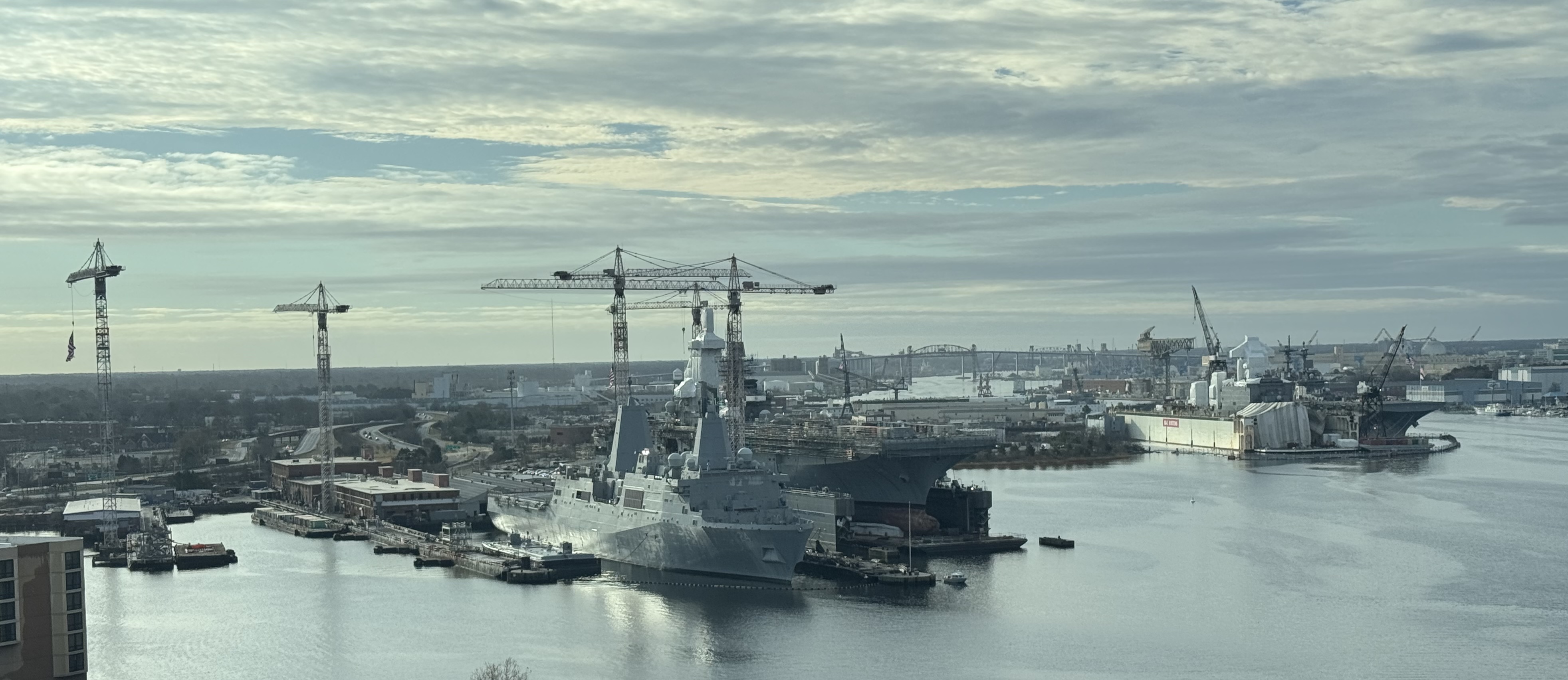 Dry docks at the National Steel and Shipbuilding Company shipyard in Norfolk, Virginia. The ships in the foreground are the USS Arlington and USS Bataan.