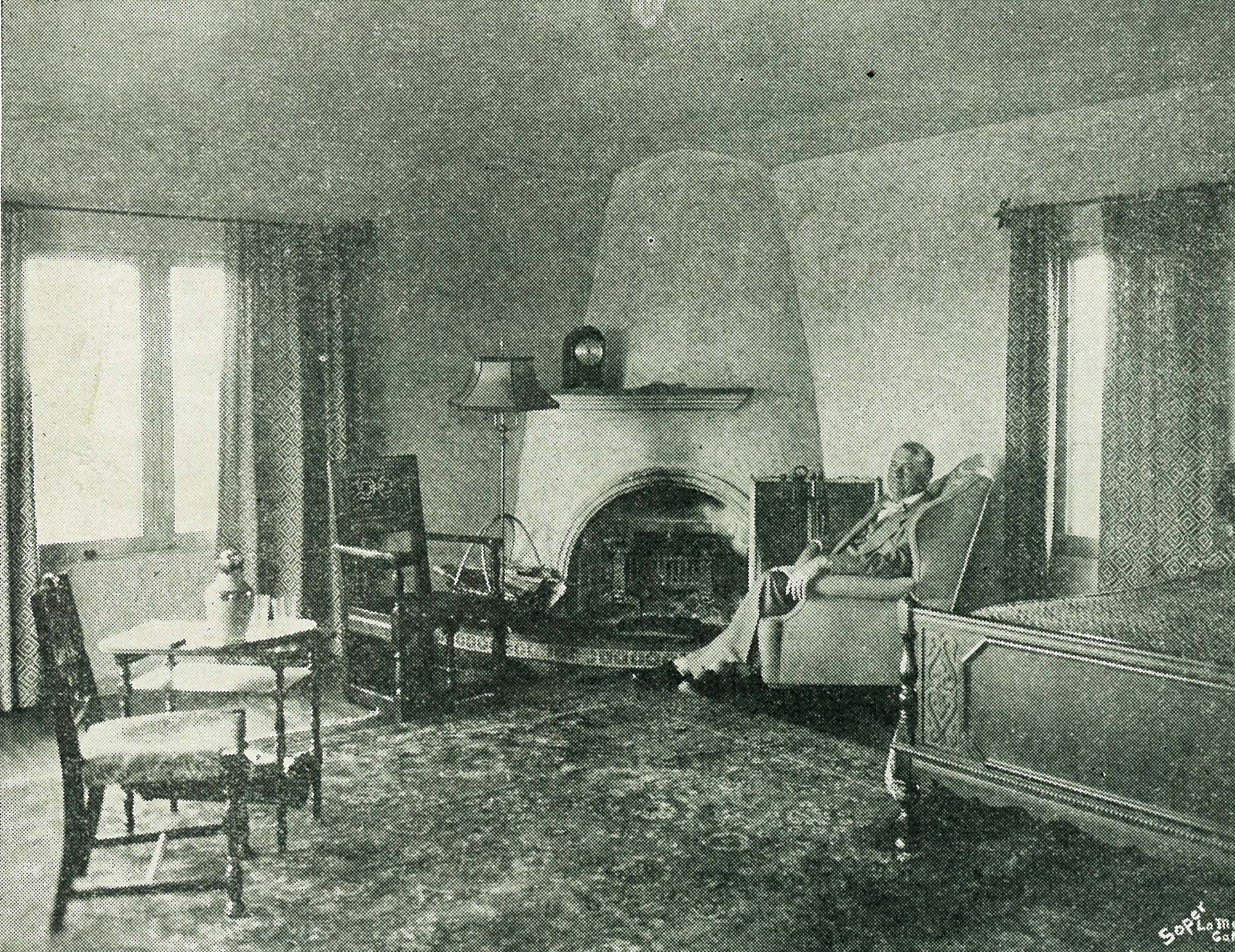 Picture taken from the July 25, 1931 Messenger of J.F. Rutherford ("Judge Rutherford") relaxing next to the fireplace in Beth Sarim, his estate in San Diego, California. 
The mansion was built in 1929 for the occupancy of the expected resurrection of Old Testament prophets ("princes"). At the time, Rutherford was president of the Watchtower Bible and Tract Society (Jehovah's Witnesses). Copyright for the Messenger was not renewed and picture is in the public domain. Picture was scanned from original magazine.