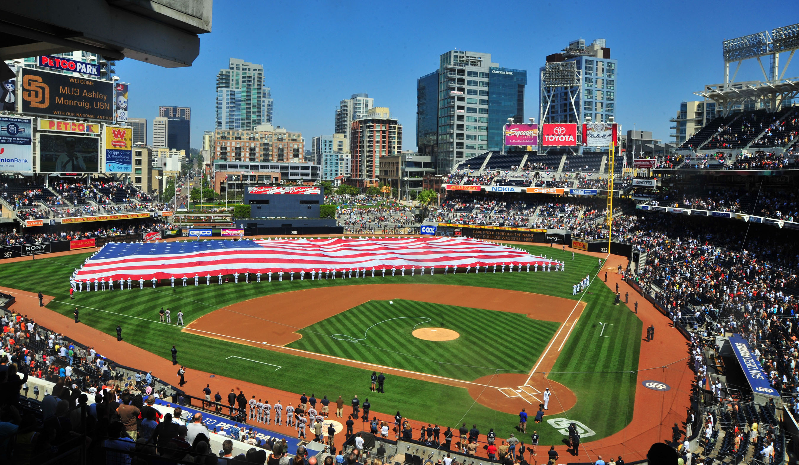 SAN DIEGO (Sept. 11, 2010) Sailors assigned to the aircraft carrier USS Carl Vinson (CVN 70) unfurl the "Pacific Life Holiday Bowl Big Flag" during pre-game activities at PETCO Park to commemorate the ninth anniversary of the Sept. 11, 2001 terrorist attacks on New York and Washington. (U.S. Navy photo by Mass Communication Specialist 2nd Class Adrian White/Released)