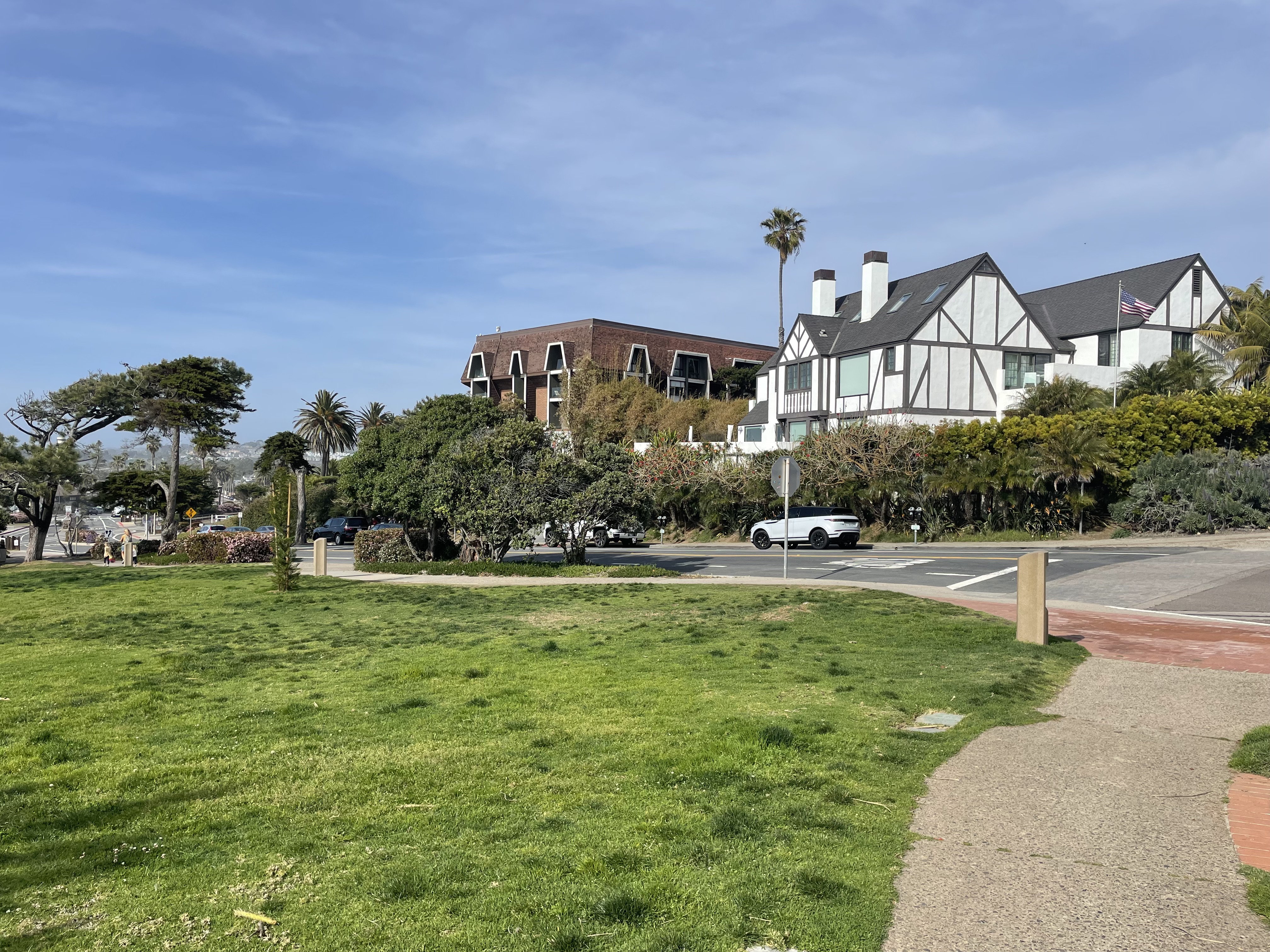A View of a Tudor Revival Style Home from Sea Grove Park on the Del Mar Coast