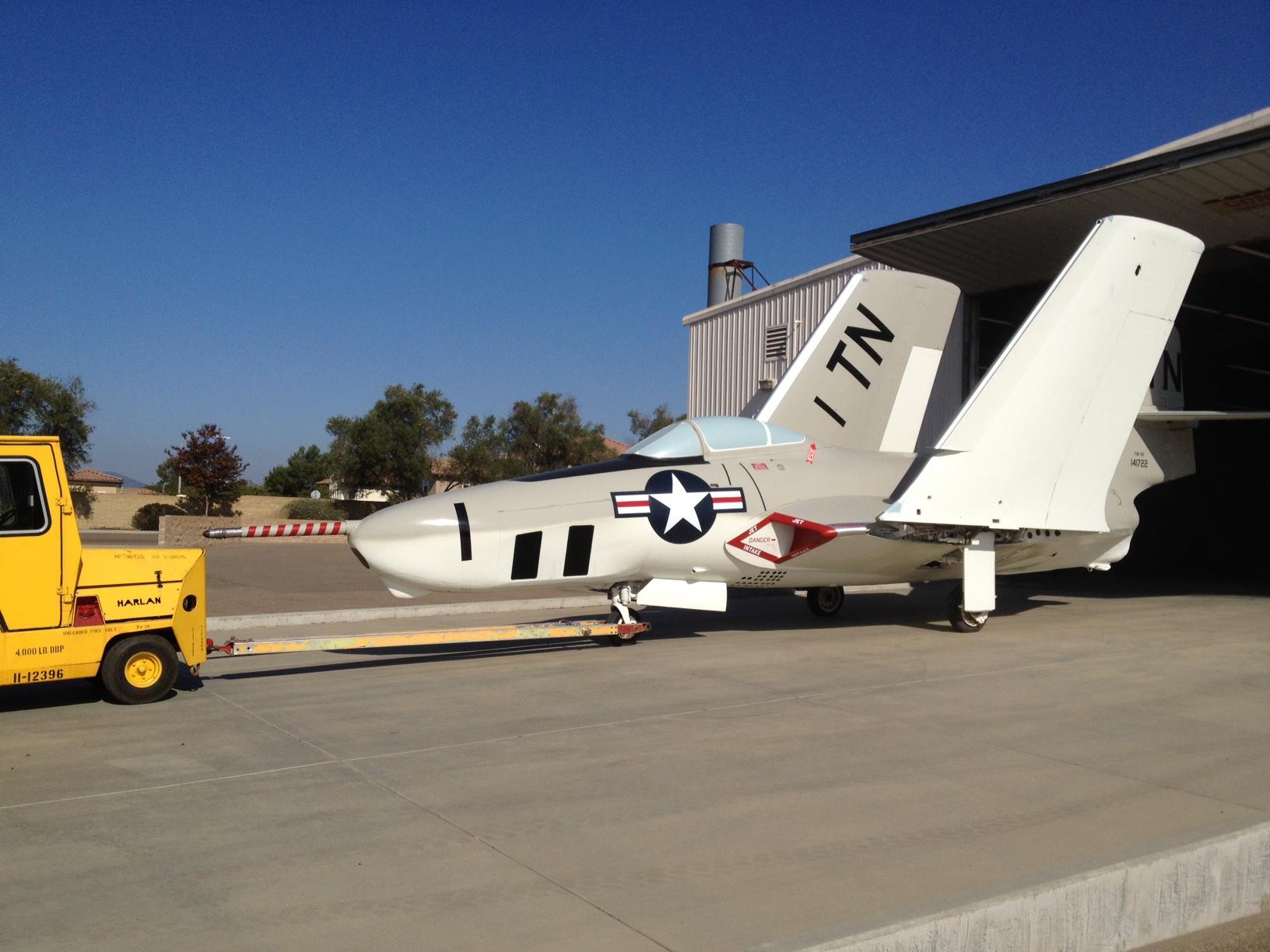 F9F-8P Cougar being rolled out of restoration hangar of the Flying Leatherneck Aviation Museum at MCAS Miramar in San Diego, California..