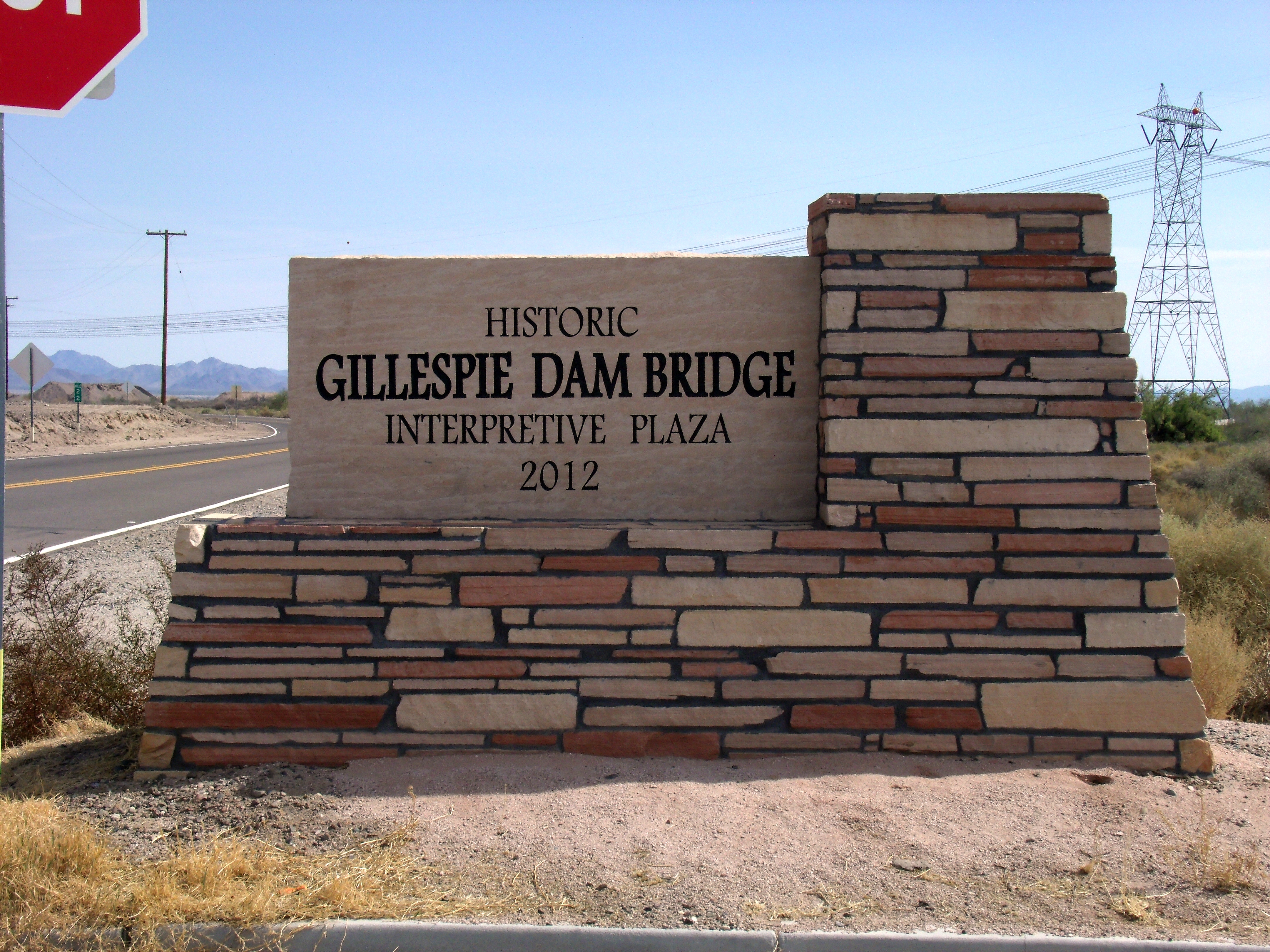 The historic Gillespie Dam Bridge marker. The historic Gillespie Dam Bridge was built in 1927 over the Gila River and is located on Old Highway 80 north of Gila Bend and south of Arlington between the Buckeye Hills and the Gila Bend Mountains in Maricopa County.  The bridge was at the time the longest highway bridge in the state of Arizona. The bridge was listed on the National Register of Historic Places on May 5, 1981, reference #81000136