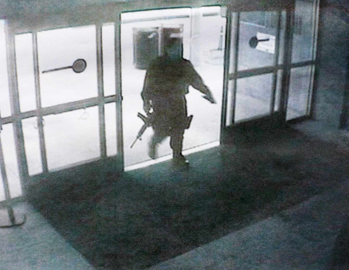 A photo of Zawhari heading into the building with his AR-15