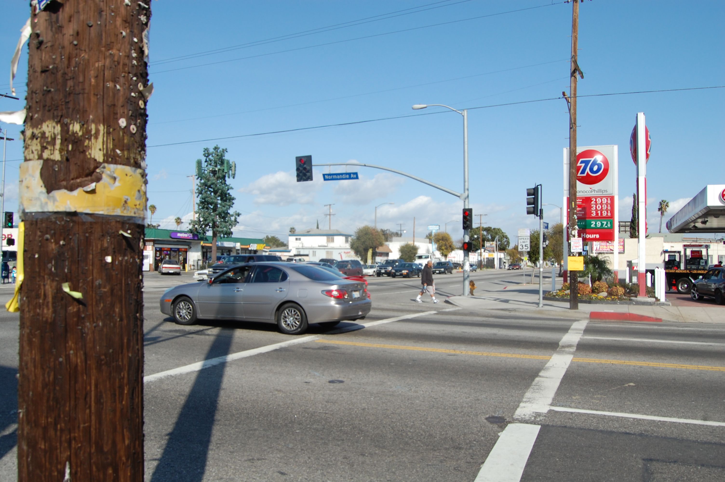 Photo taken from the southwest corner of Florence and Normandie, looking northeast. Tom's Liquor, one of the first stores looted in the riots, still exists in the green-roofed building beyond the intersection.