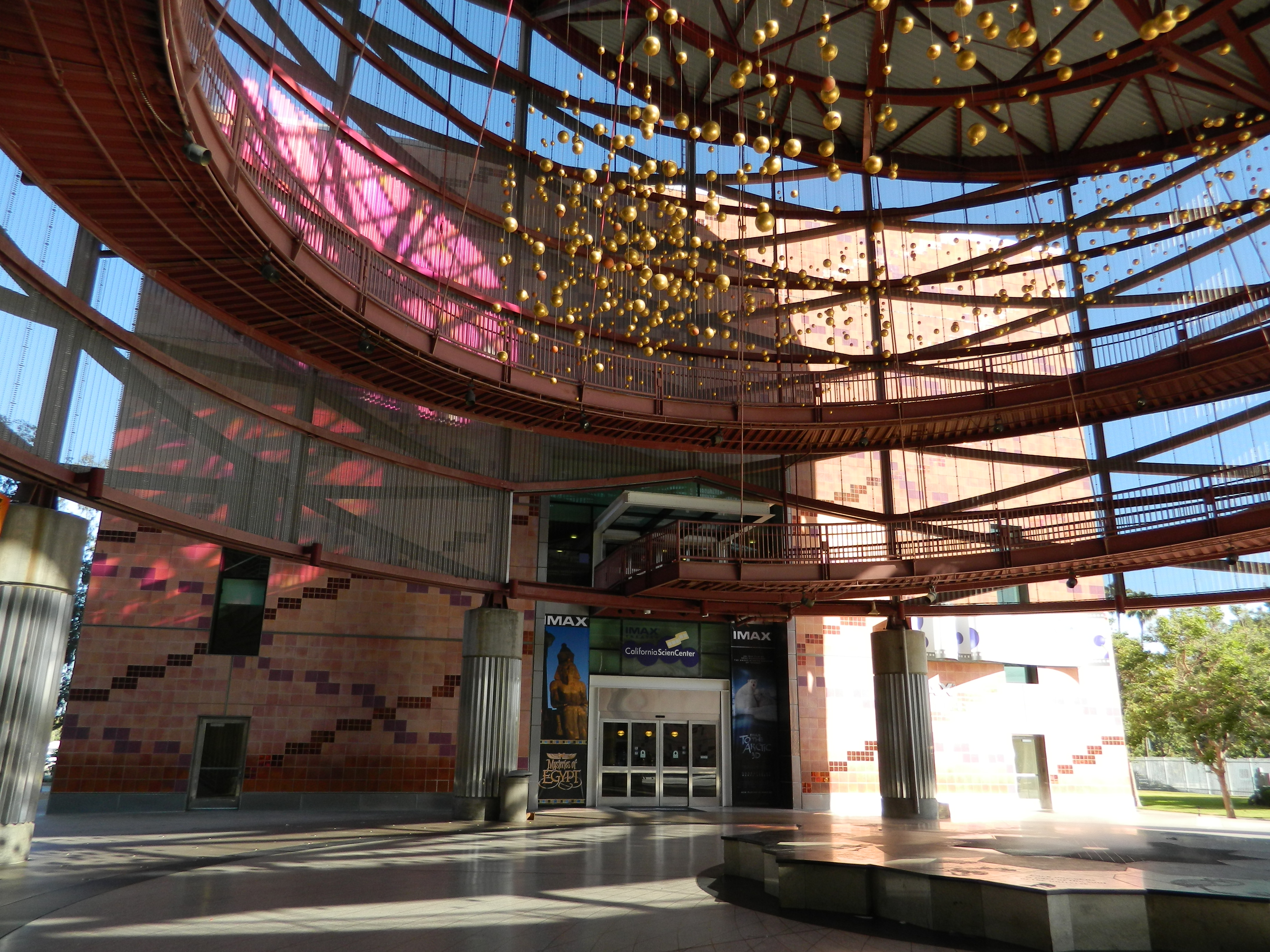 Main entrance rotunda at the California Science Center.
With the "Orbs" hanging sculpture, balconies, and the IMAX Theater entrance foyer.
In Exposition Park, Los Angeles, California.