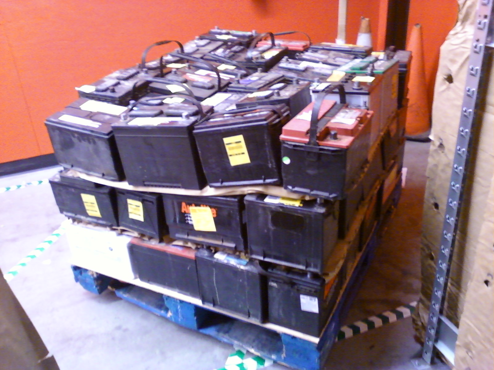 A palletload of used car batteries, collected by Autozone store #4121 (an auto parts retailer) from their customers.  This pallet contains approximately 75 batteries, and weighs approximately 2500 pounds.  It is in the process of being prepared for interstate truck shipment.  It will have a flat sheet of cardboard laid over the top and will be wrapped in plastic cling-film wrap, at which point it will be ready for transport to an Autozone distribution center.
Nearly all of the batteries on this pallet were collected as exchanges during the sale of a new battery.  1 or 2 were dropped off by customers in exchange for $5 store credit.  One battery was left by a customer for charging and testing, who never returned to pick it up.

All the batteries on this pallet failed a load test at the output for which they were rated.  The load tests were performed by an Autometer BVA-200s battery tester, after a 50 Amp quick charge (if necessary).