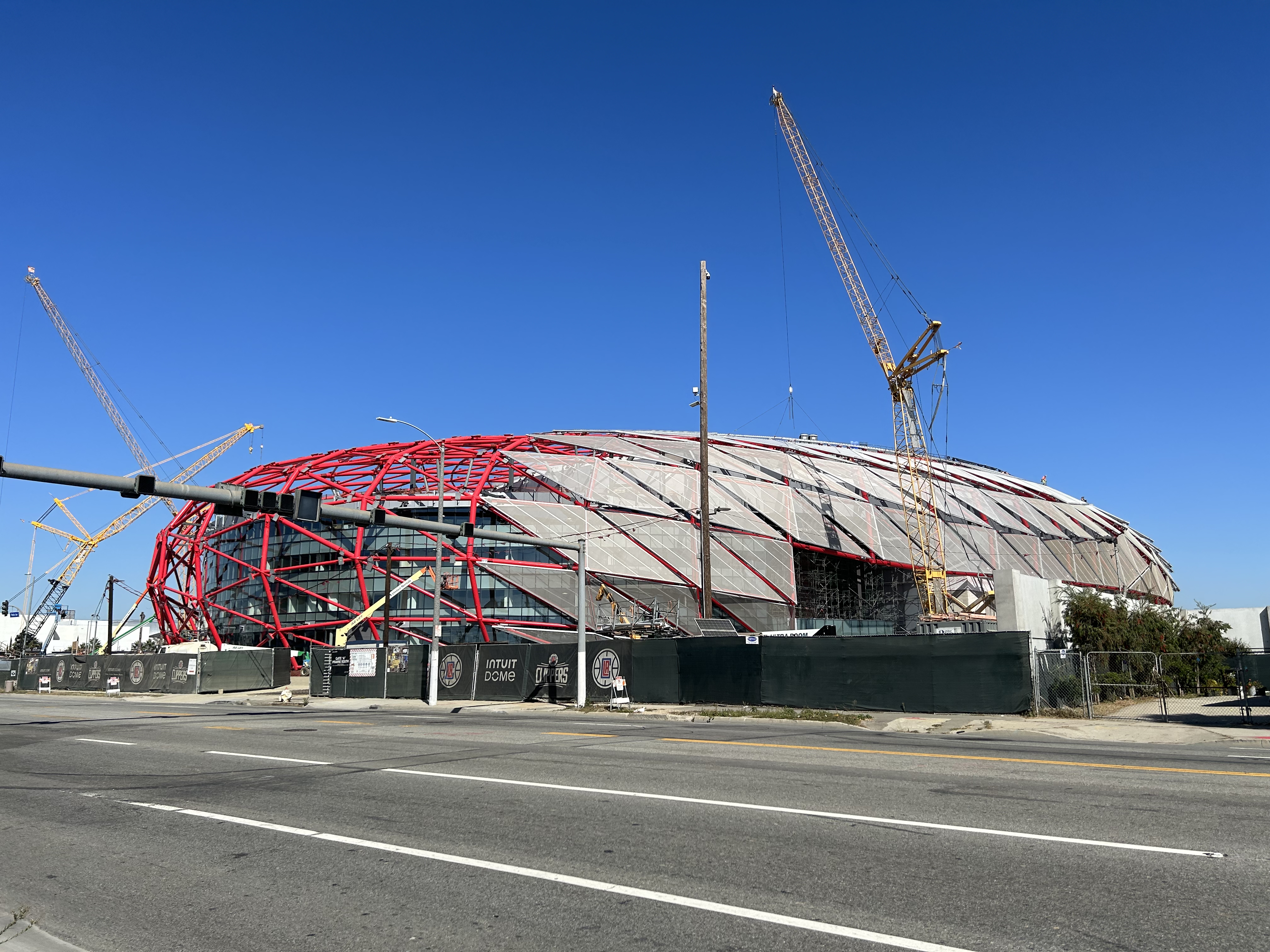 The Intuit Dome under construction from October 2023, as seen from the corner of S Prairie Ave and W 103rd St in Inglewood.