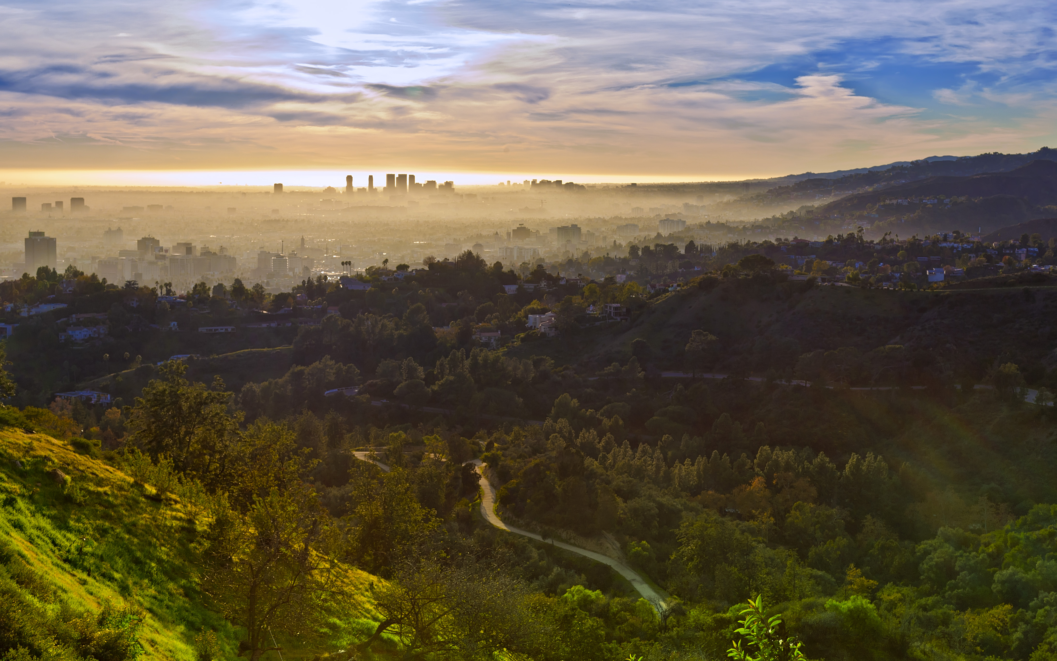 Took this nice landscape [Ed. note: of West Los Angeles, including Hollywood in the foreground and Century City on the horizon just left of center] from the Griffith Park Observatory.
There is some glare around the bottom right of this photo, I try my best to control. 
Love my 50L so much, it shows great detail around the aperture 8.0-11.0
I have Cokin GND 0.9, but I found the color cast is obvious to see before the Photoshop process. Not highly recommended~

No HDR process. Trying the RAW format, you may get more detail than you imagine!