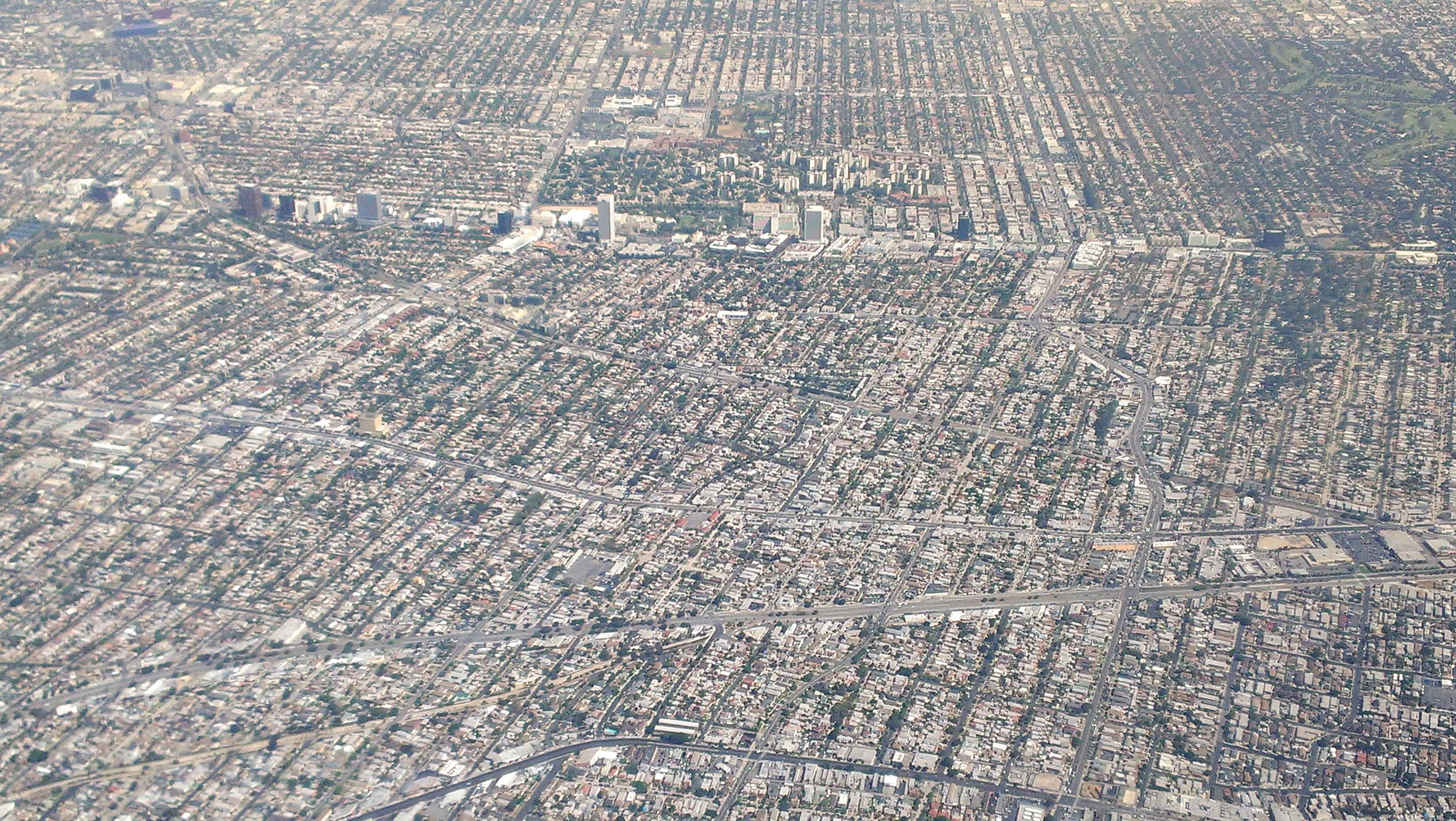 Wilshire Blvd is the street running horizontally with the tall buildings.