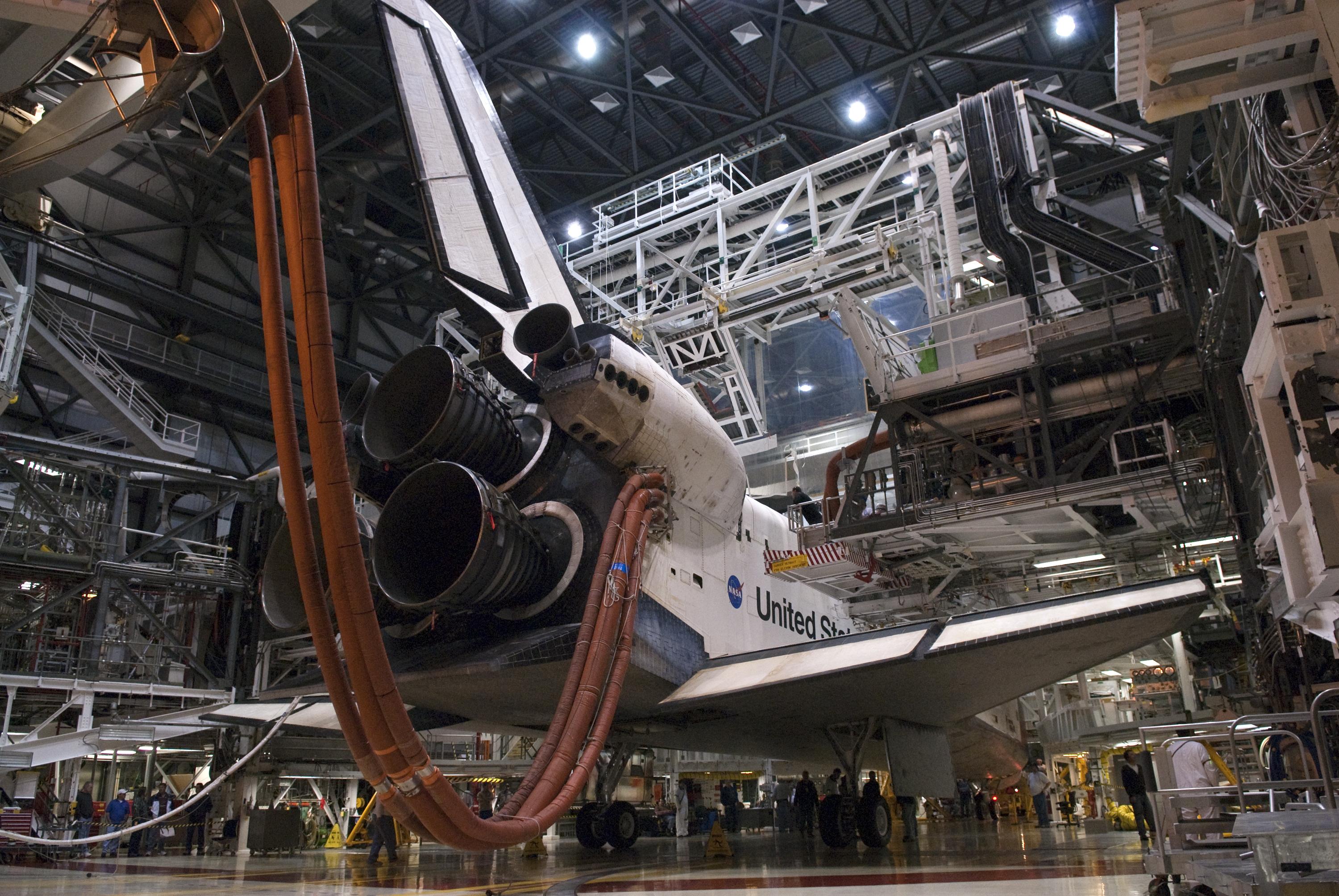 At NASA's Kennedy Space Center in Florida, work platforms are moved into position around space shuttle Endeavour in Orbiter Processing Facility-2, following its touchdown at the completion of the STS-130 mission to the International Space Station. Processing now begins for Endeavour's next flight, STS-134. The six-member STS-134 crew will deliver the ExPRESS Logistics Carrier 3 and the Alpha Magnetic Spectrometer to the International Space Station, as well as a variety of spare parts including two S-band communications antennas, a high-pressure gas tank, additional spare parts for Dextre and micro-meteoroid debris shields. STS-134 will be the 35th shuttle mission to the station and the 133rd flight in the shuttle program.
