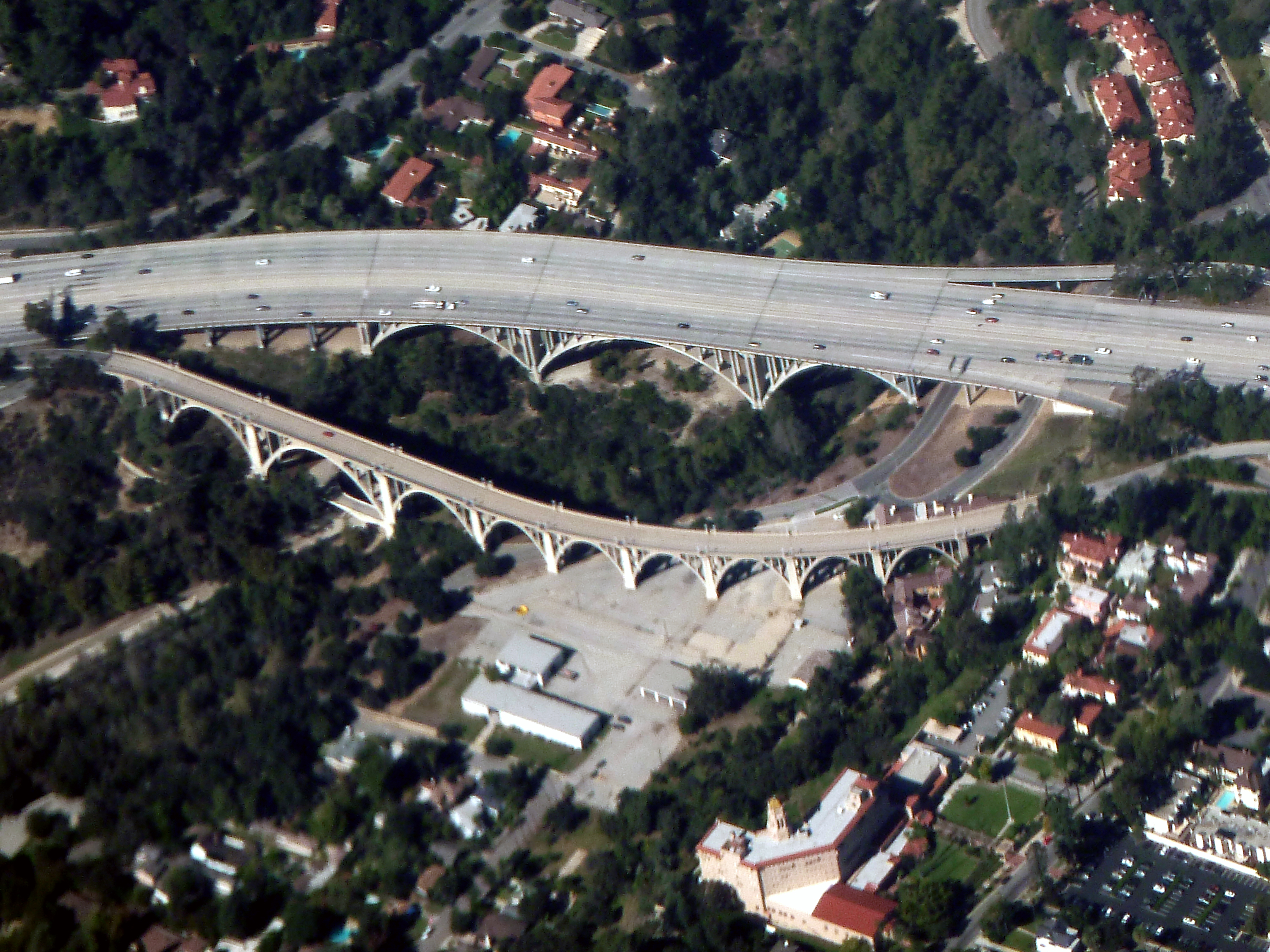 Aerial view of the Colorado Street Bridge (bottom), with the Arroyo Seco Bridge of State Route 134 (above).
Crossing the Arroyo Seco (canyon and creek).
In Pasadena, Southern California.