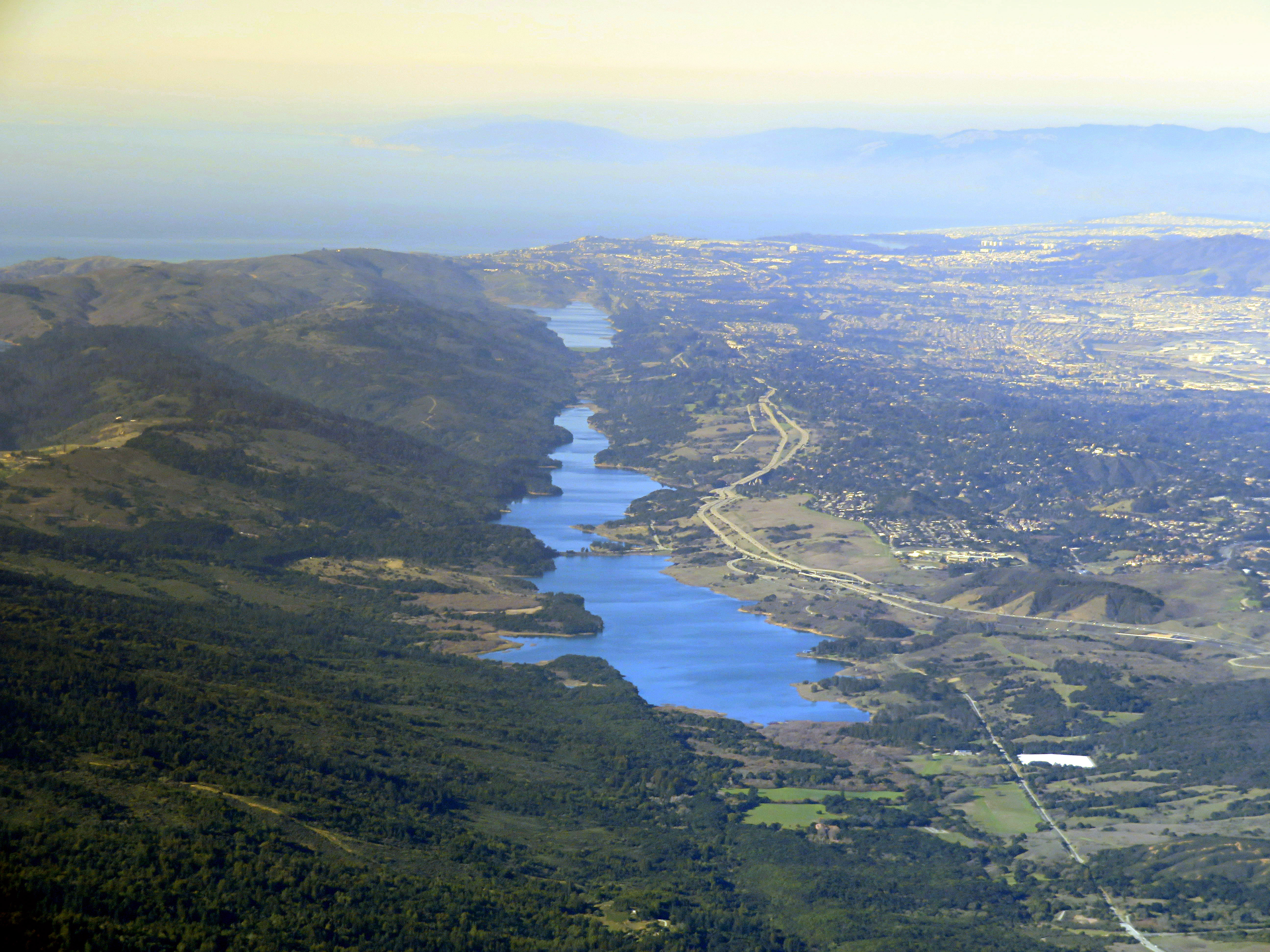 Aerial view of Crystal Springs Reservoir (and behind it, San Andreas Lake) in February 2018