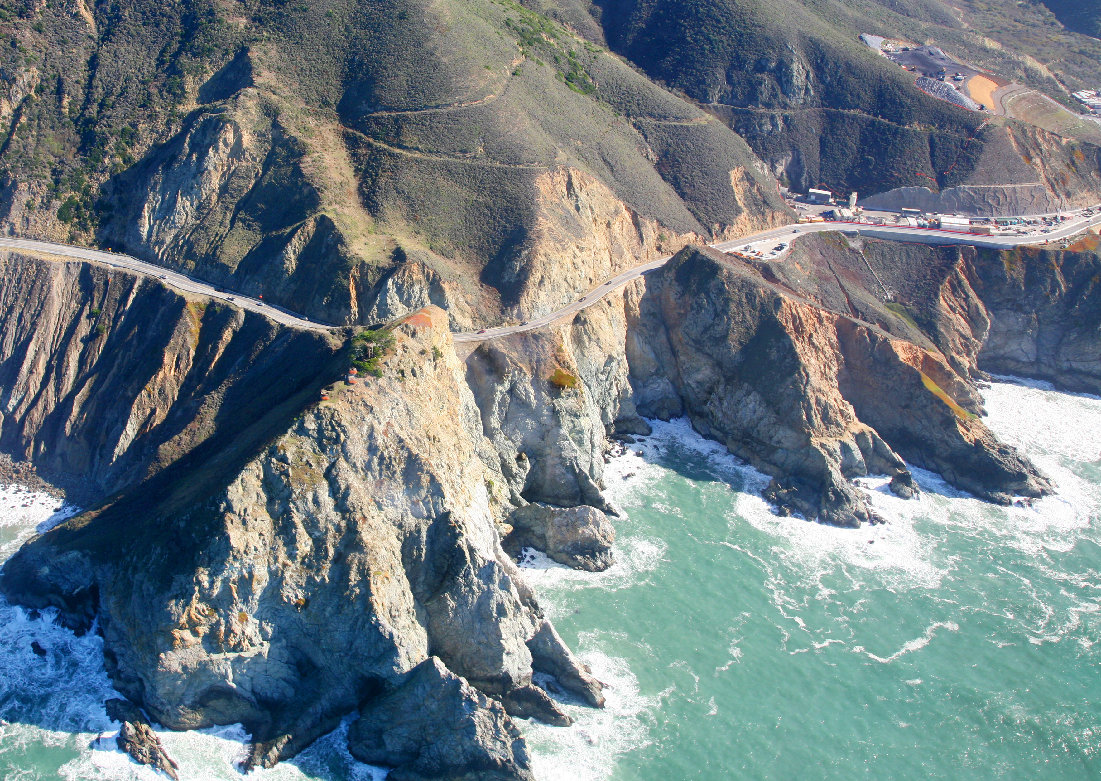 The road along the coast south from San Francisco passes along beaches as well as along steep cliffs. At one such spot it traditionaly fails every winter, and part of the road falls into the ocean, the road is closed, and what for some people used to be a 15 minute drive turns into an hour's detour to get to work.

Repairs can take anywhere from 6 weeks (good) to most of a year (bad)