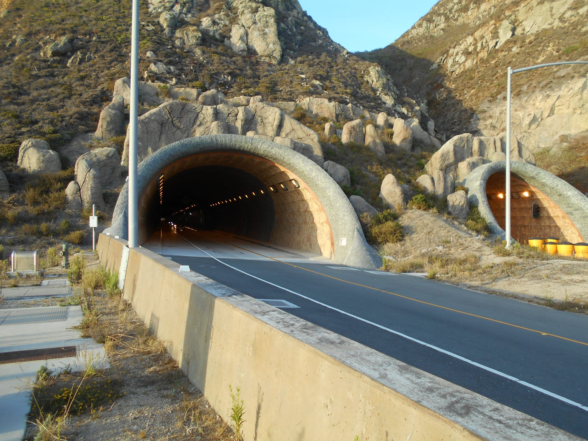 Looking back at south entrances for Devil's Slide tunnel for the cars and trucks