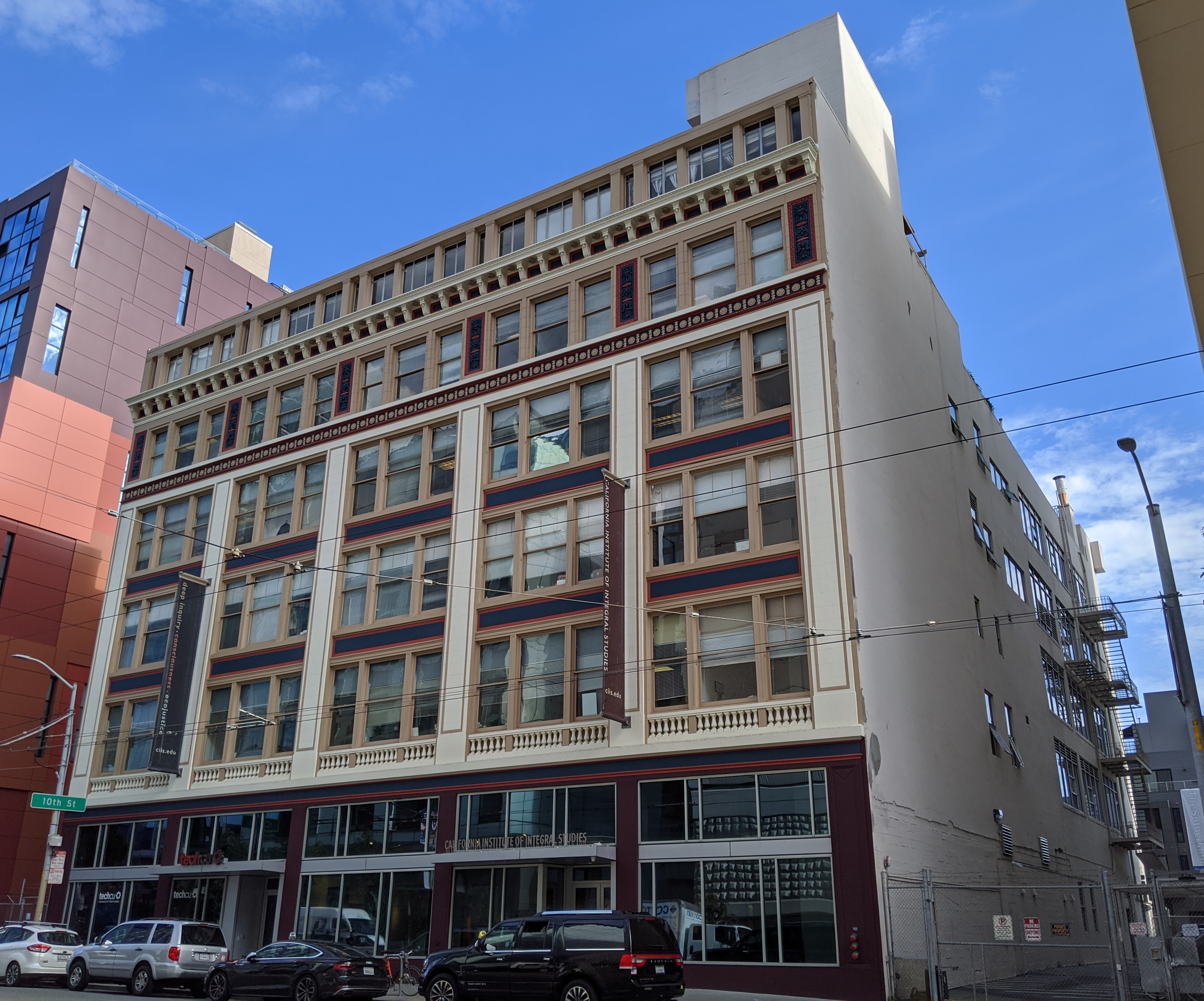 The main campus of the California Institute of Integral Studies in San Francisco's South of Market (SoMA) neighborhood, seen across Mission Street, with a branch of Tech CU on the lower left