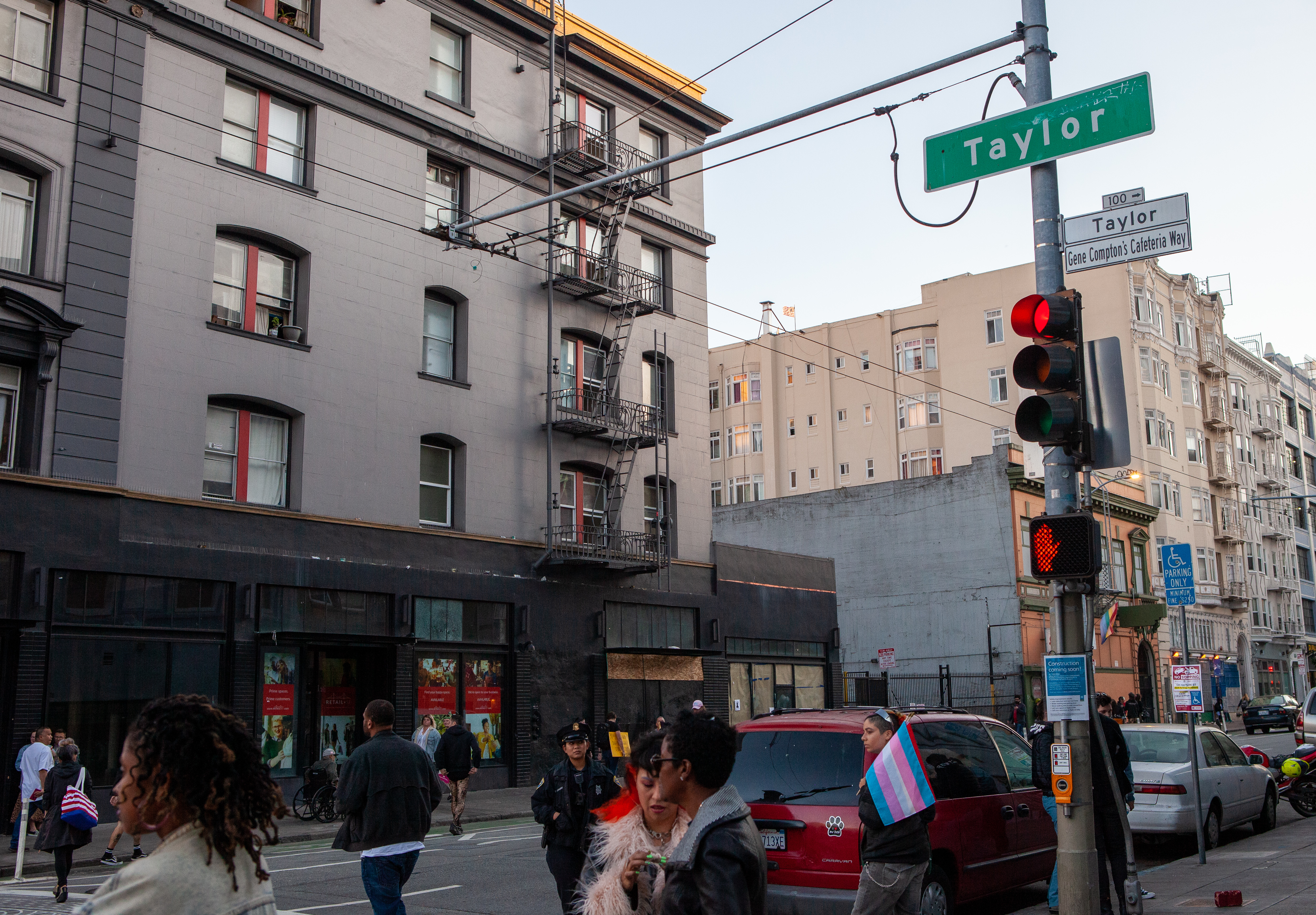 The intersection of Taylor and Turk Streets in the Compton's Transgender Cultural District, following the 2019 San Francisco Trans March. A sign under the Taylor street sign reads "Gene Compton's Cafeteria Way".