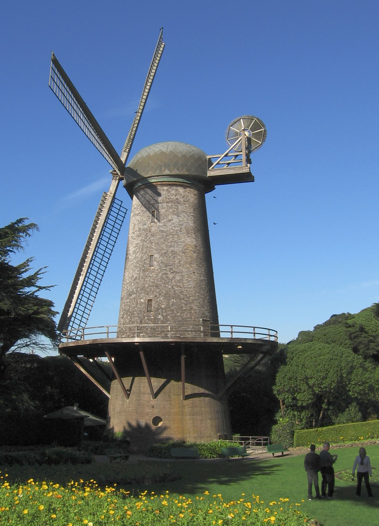 North Windmill in Golden Gate Park. Built in 1903, it was used to pump water throughout the park. The blades seen here were used to carry canvas sails. The smaller wind wheel was connected to gearing that rotates the main blades into the wind. Image by User:SamuelWantman.  
See also: 100px