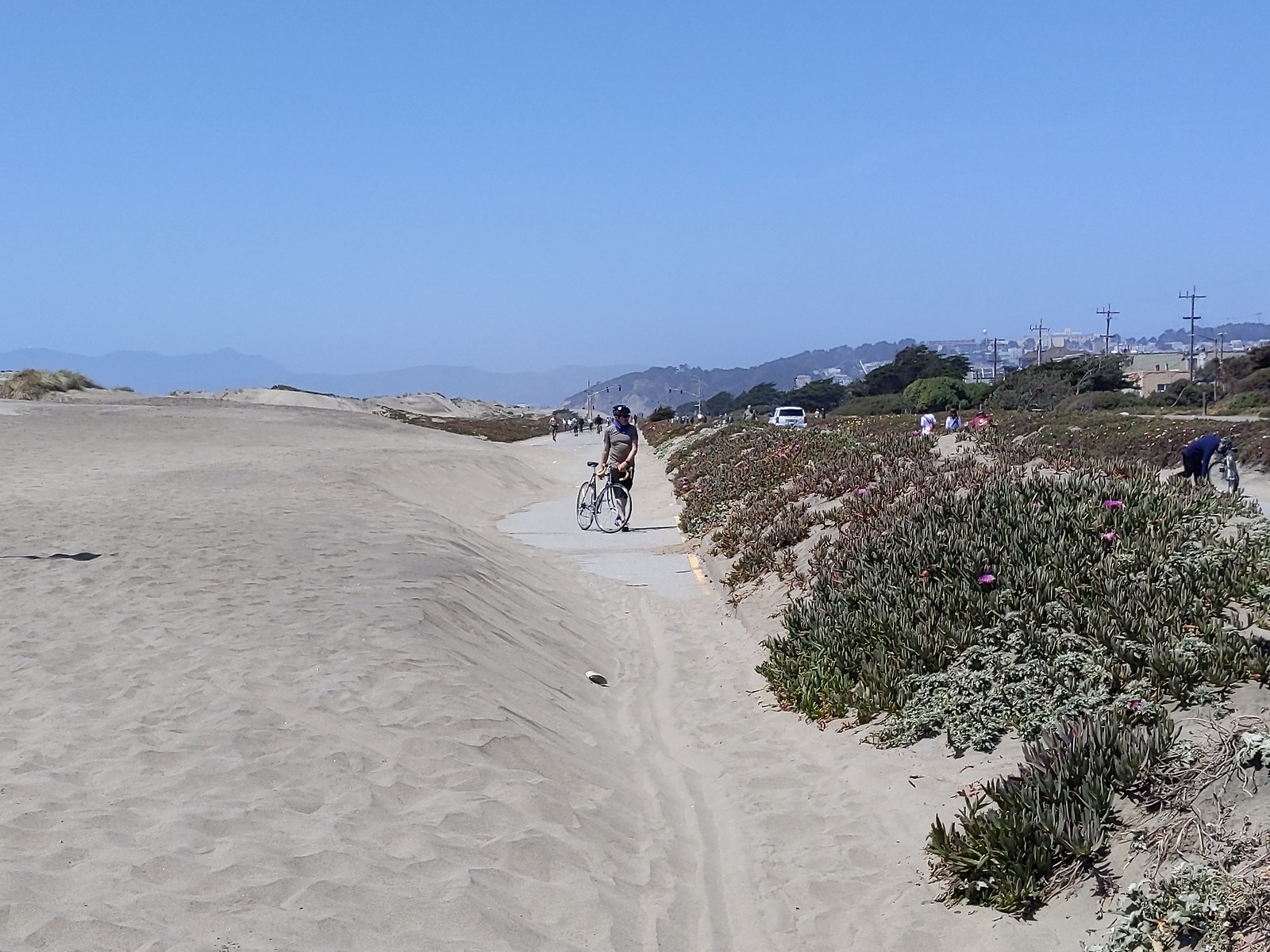 The Great Highway / Great Walkway often gets covered with sand from Ocean Beach.