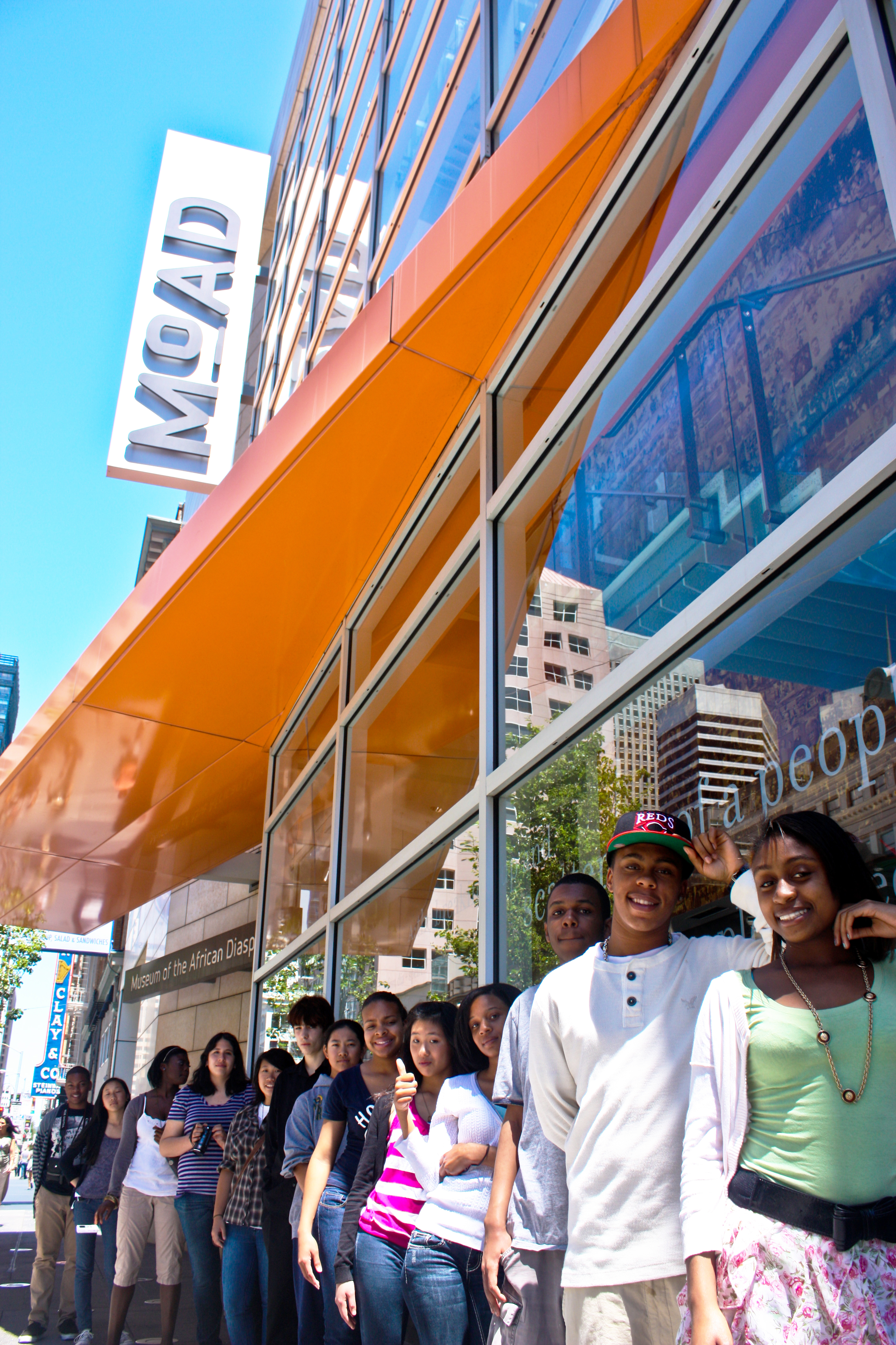 Museum of the African Diaspora members stand outside the museum, awaiting a tour.