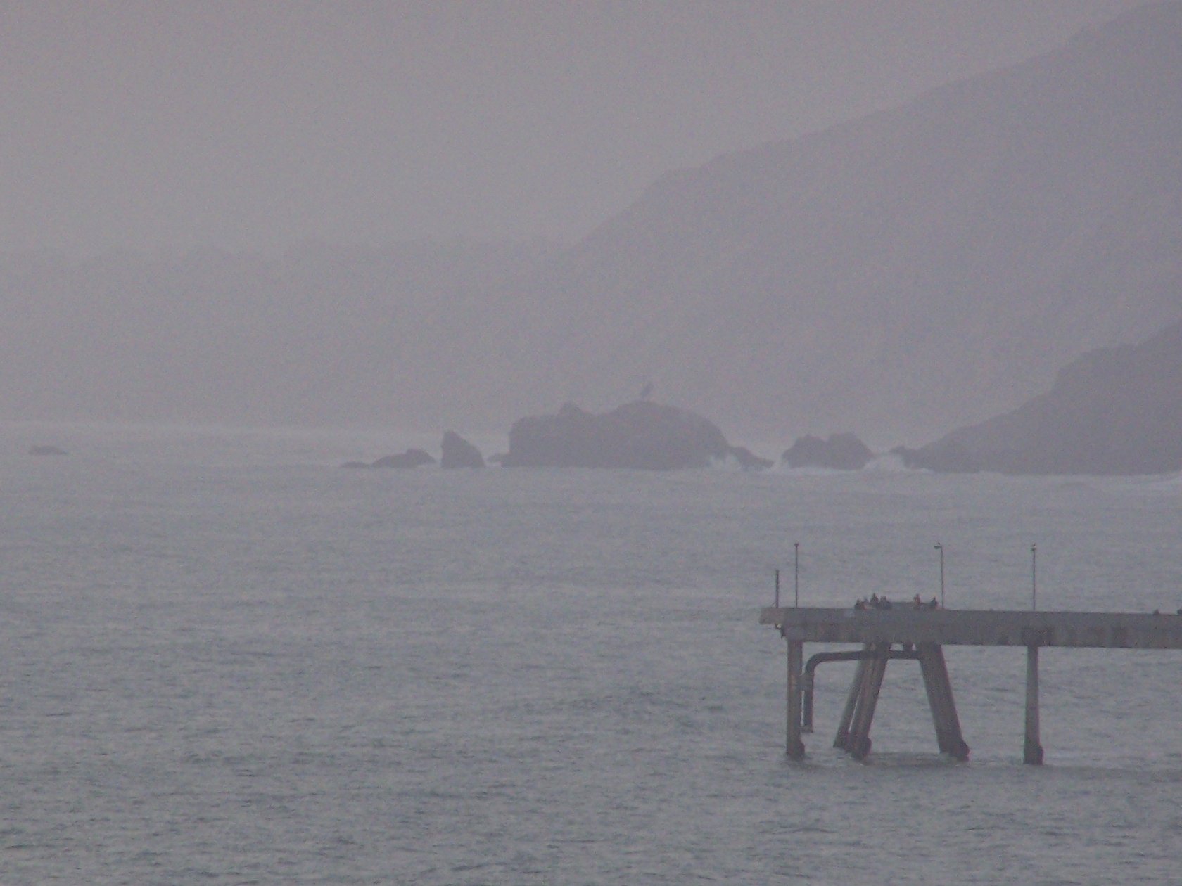 Mussel Rock, as viewed from Mori Point in Pacifica, CA. Mussel Rock, located off the coast of Daly City, CA, is where the San Andreas Fault goes offshore from the San Francisco Peninsula. It is also the approximate location of the epicenter of the 1906 San Francisco earthquake.