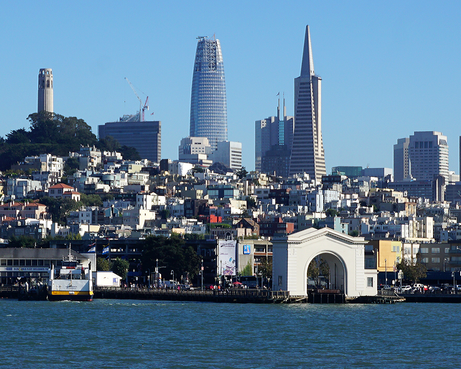San Francisco skyline from the bay near Fisherman's Wharf. From left to right Coit Tower, Salesforce Tower, 345 California Center, and Transamerica Pyramid.