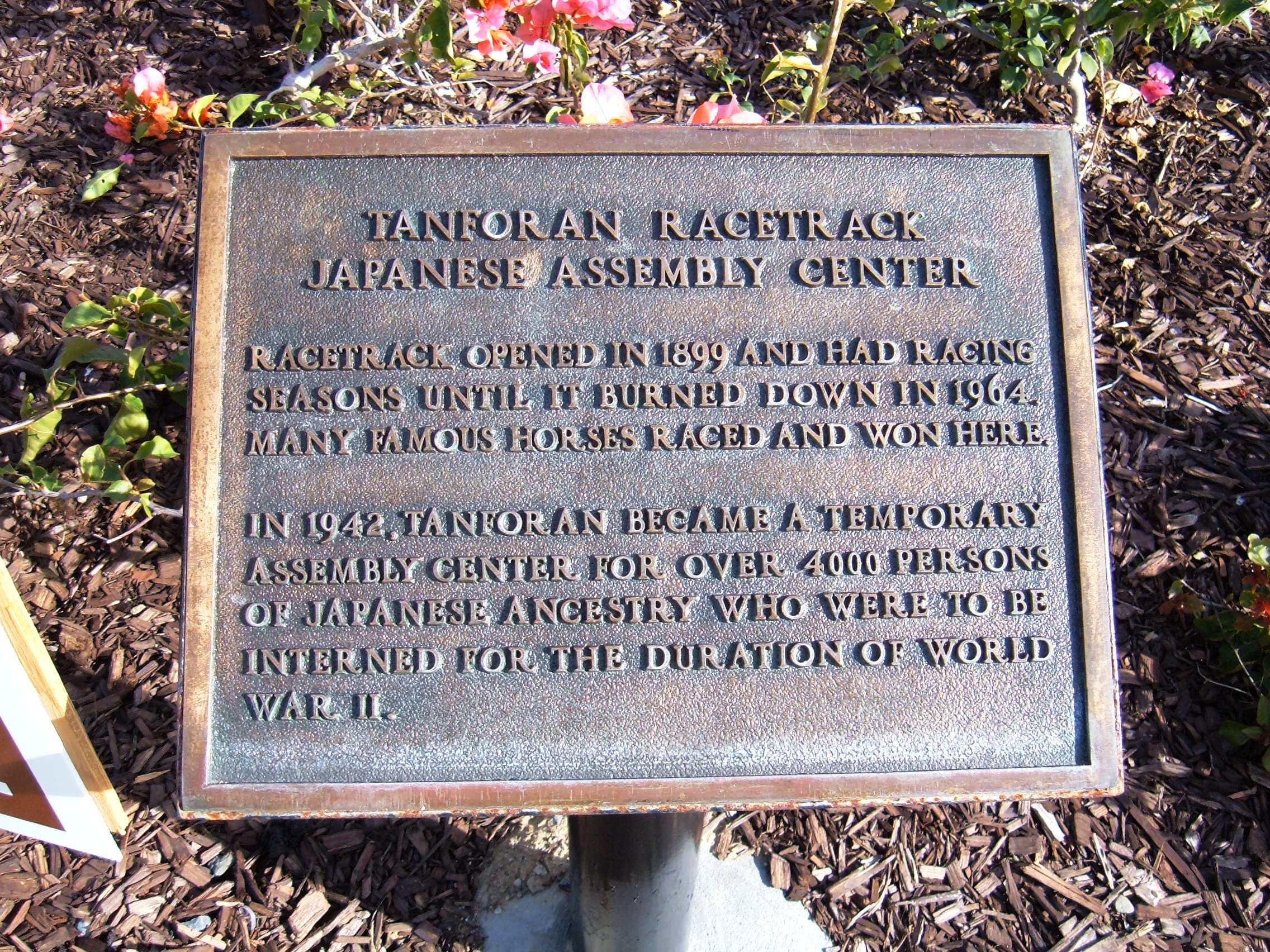 Plaque commemorating the Tanforan Assembly Center| — the use of Tanforan Racetrack as an assembly point/barracks for removal of Japanese-Americans in 1942.

On the grounds of the Shops at Tanforan in San Bruno, California.