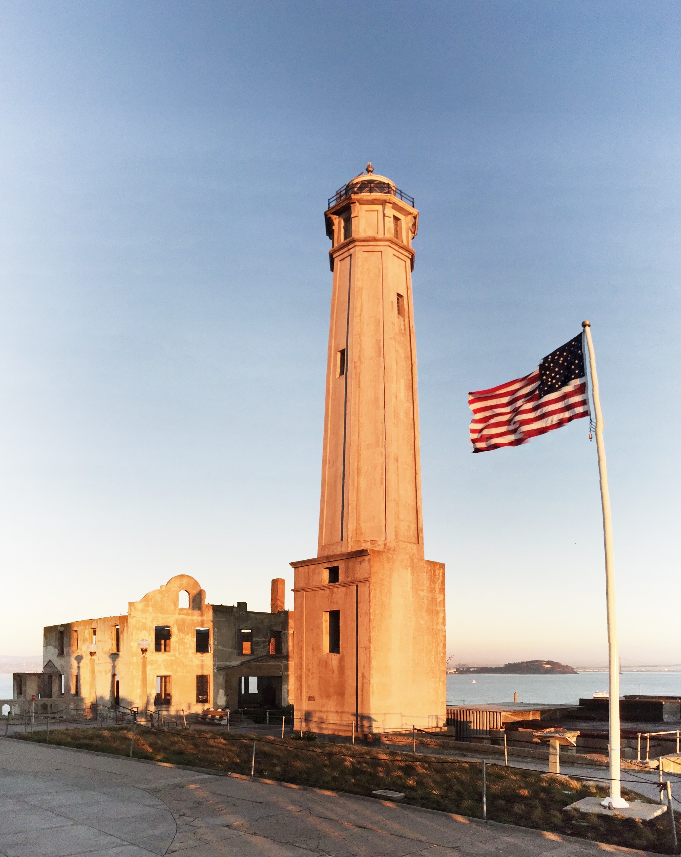 Alcatraz lighthouse, as photographed from ground level, Yerba Buena island in the background