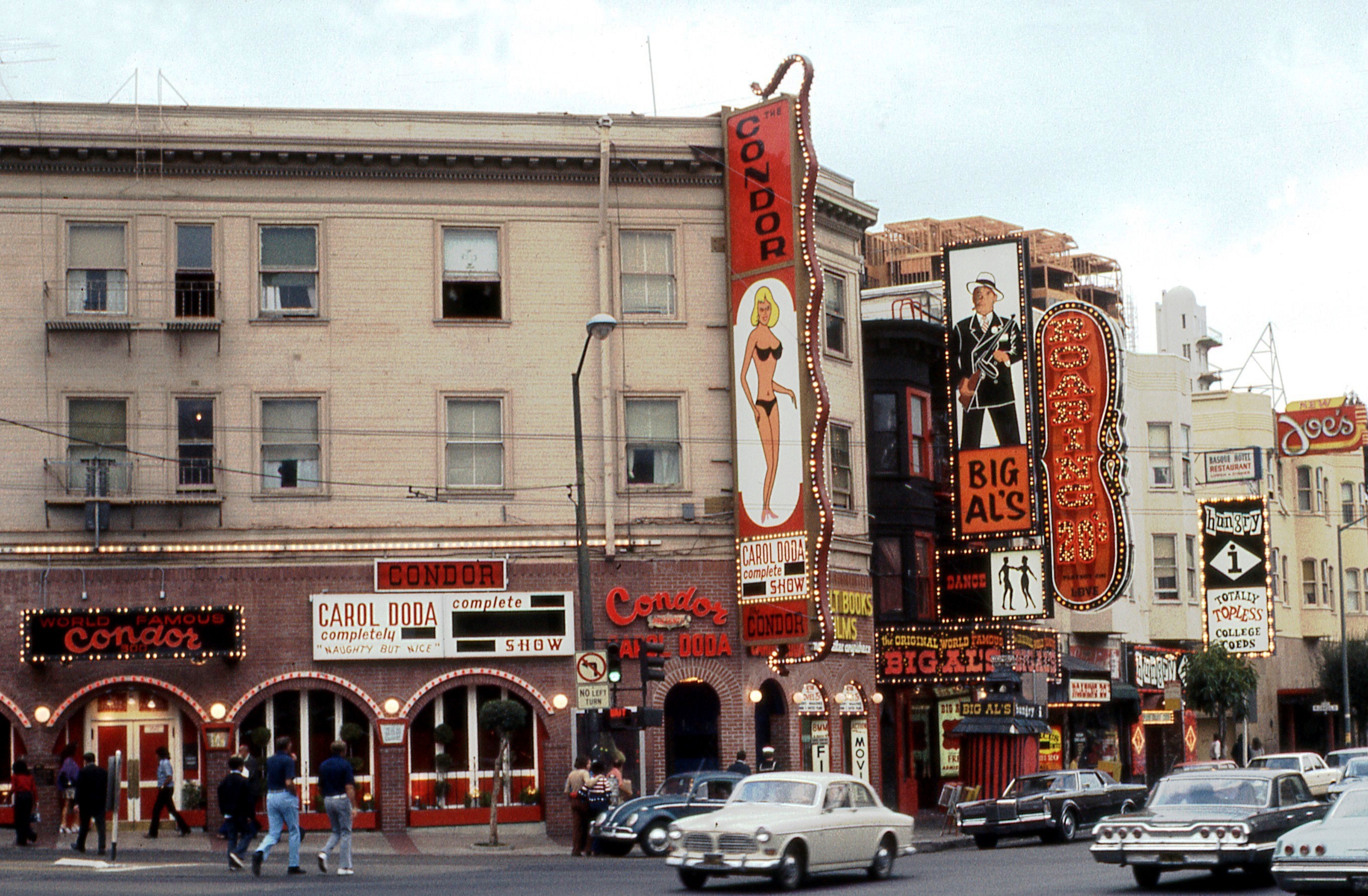 North Beach, San Francisco, California, North East corner of Broadway and Columbus (1973). Carol Doda's Condor Club, Big Al's, Roaring 20s and Hungry I strip clubs.
Dianne Feinstein was on the Board of Supervisors when San Francisco began enforcing a sign ordinance in early 1973 banning words such as "nude", "bottomless" and "stark naked". The Condor sign said "Carol Doda Complete Nude Sex Show". The offending words were covered when this picture was taken in June 1973; the signs were modified by September as shown in this picture. File:Carol Doda Condor Club 1973.jpg

From a 35 mm Ektachrome transparency taken with a Yashica TL Electro SLR camera. Scanned with an Epson Perfection V500 Photo.