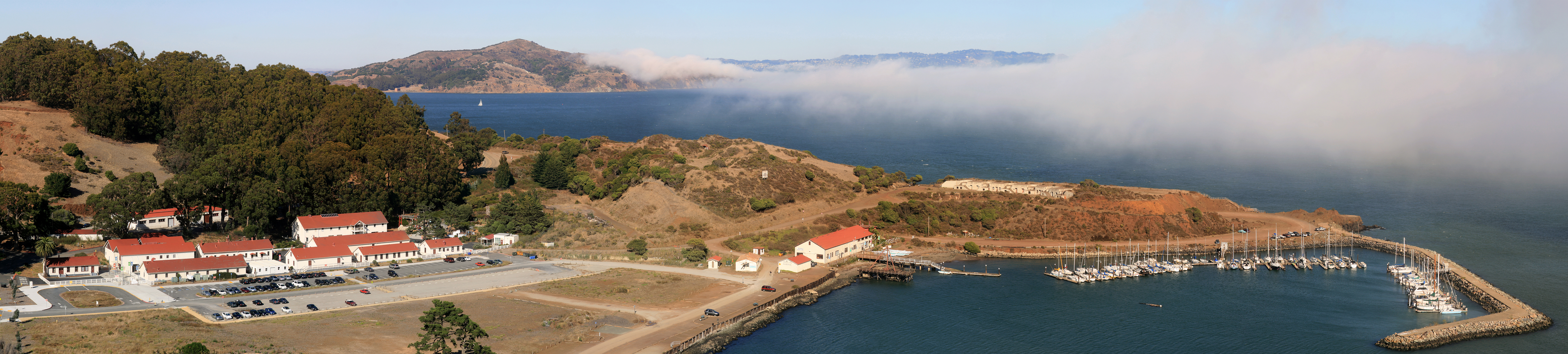 The Fort Baker, which borders the City of w:Sausalito in w:Marin County and is connected to w:San Francisco by the w:Golden Gate Bridge, served as an Army post until the mid-1990s, when the headquarters of the 91st Division moved to w:Parks Reserve Forces Training Area.The famous w:San Francisco fog is seen at the Bay