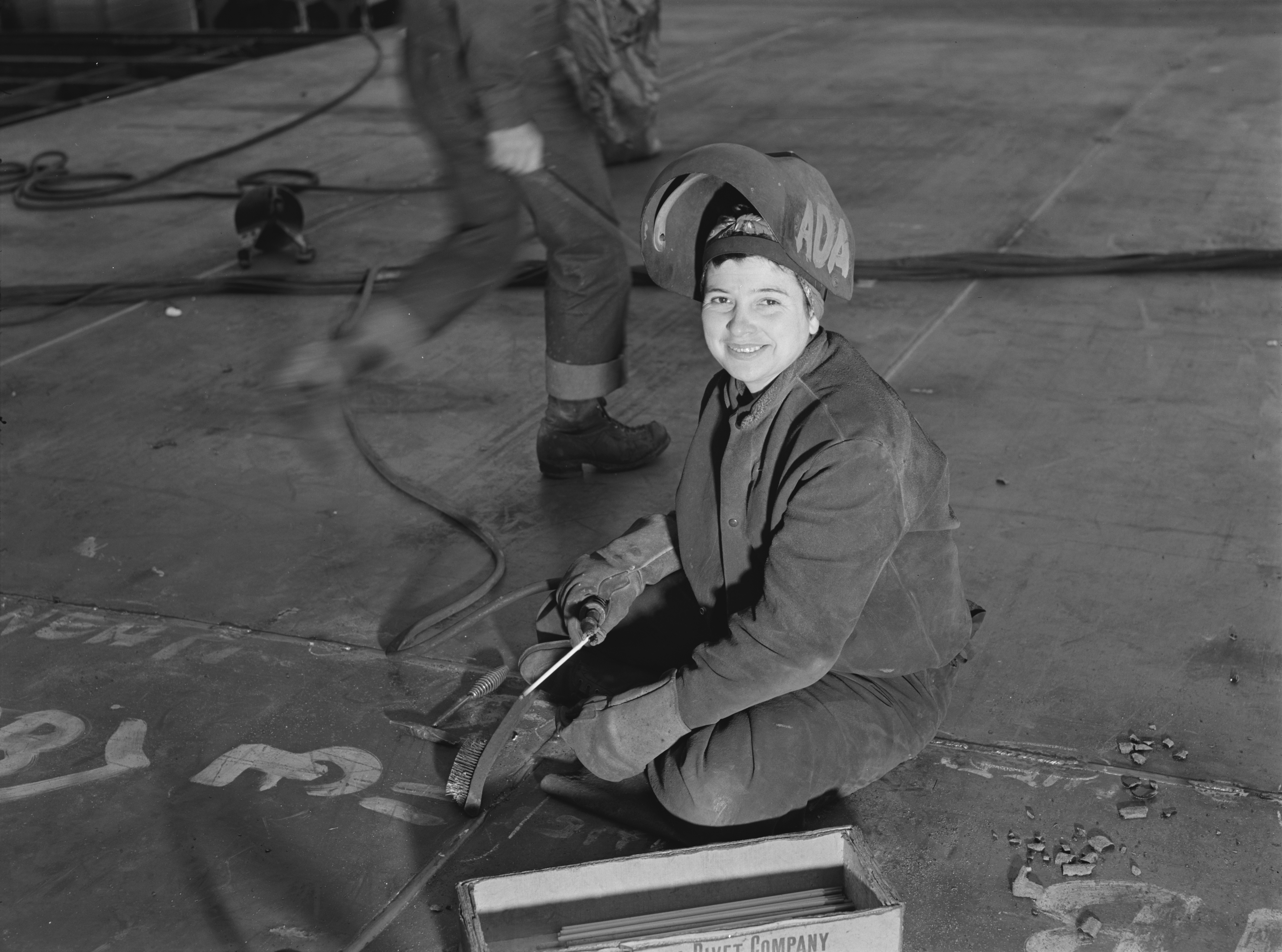 A "Wendy Welder" (see Rosie the Riveter) at the Richmond Shipyards, Richmond, California, USA. This woman worker pushes back her helmet during a moment's pause from her welding job at the Richmond shipyard in California.