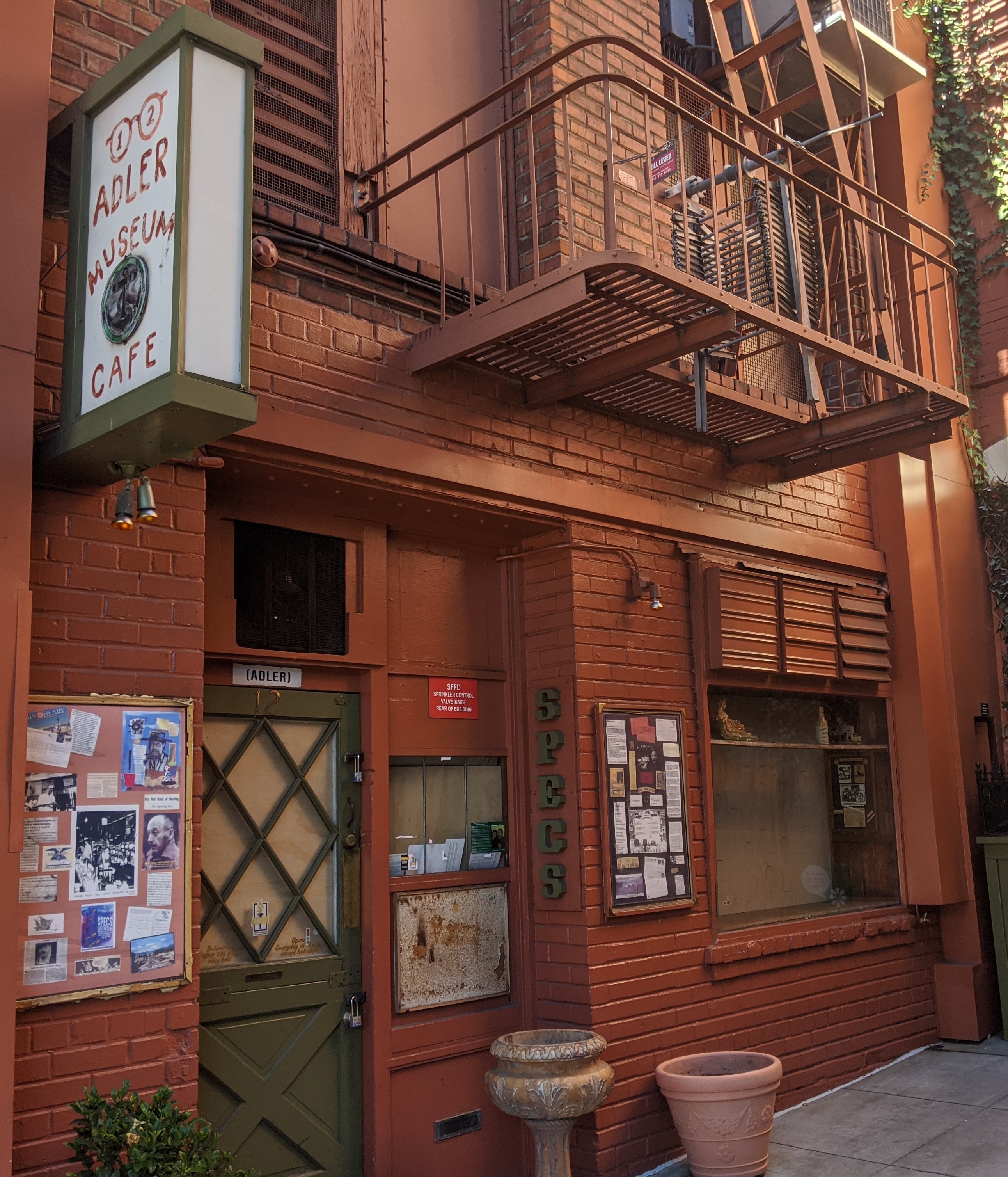 The outside of the bar Specs' Twelve Adler Museum Cafe at 12 William Saroyan Place in San Francisco, California (during the COVID-19 pandemic, August 2020)