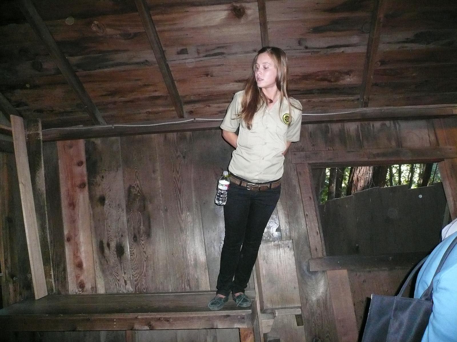 Guide leaning on table The Mystery Spot