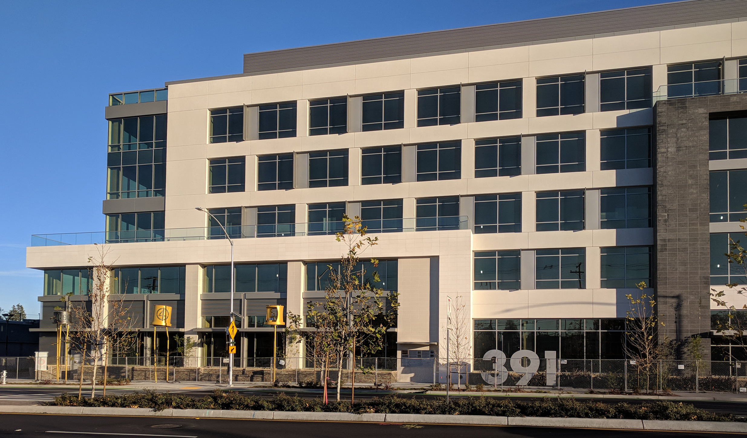 The 391 San Antonio Road, Mountain View, site of the Shockley Semiconductor Laboratory, in Dec. 2017.  The new project being completed here includes a display of sculptures of packaged semiconductors, including a transistor and a diode, standing above the sidewalk (three are seen at the left here).