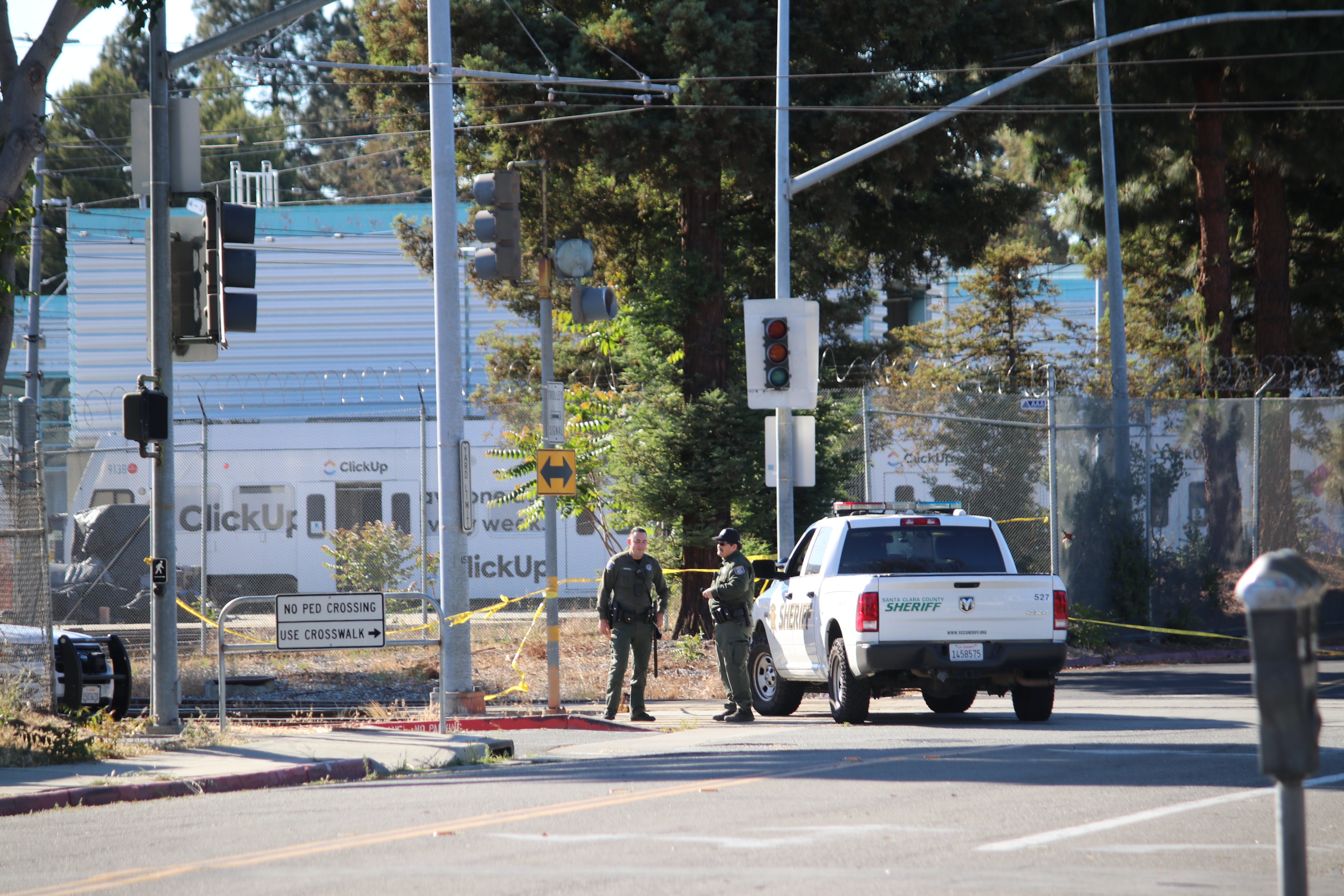 Santa Clara County Sherrif's deputies block access to the VTA railyard a day after the 2021 San Jose shooting where 9 people were killed.